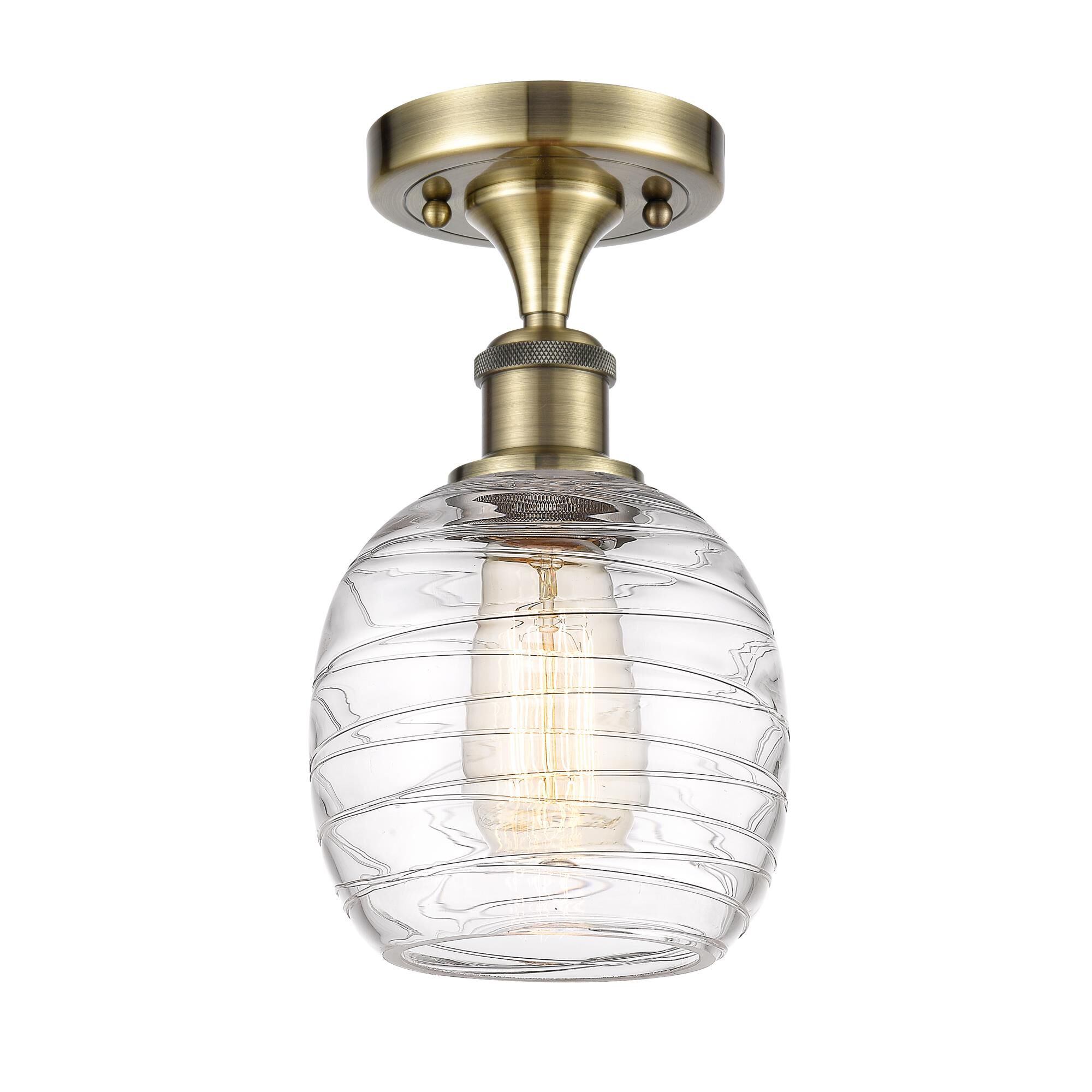 Shown in Antique Brass finish and Deco Swirl Belfast glass