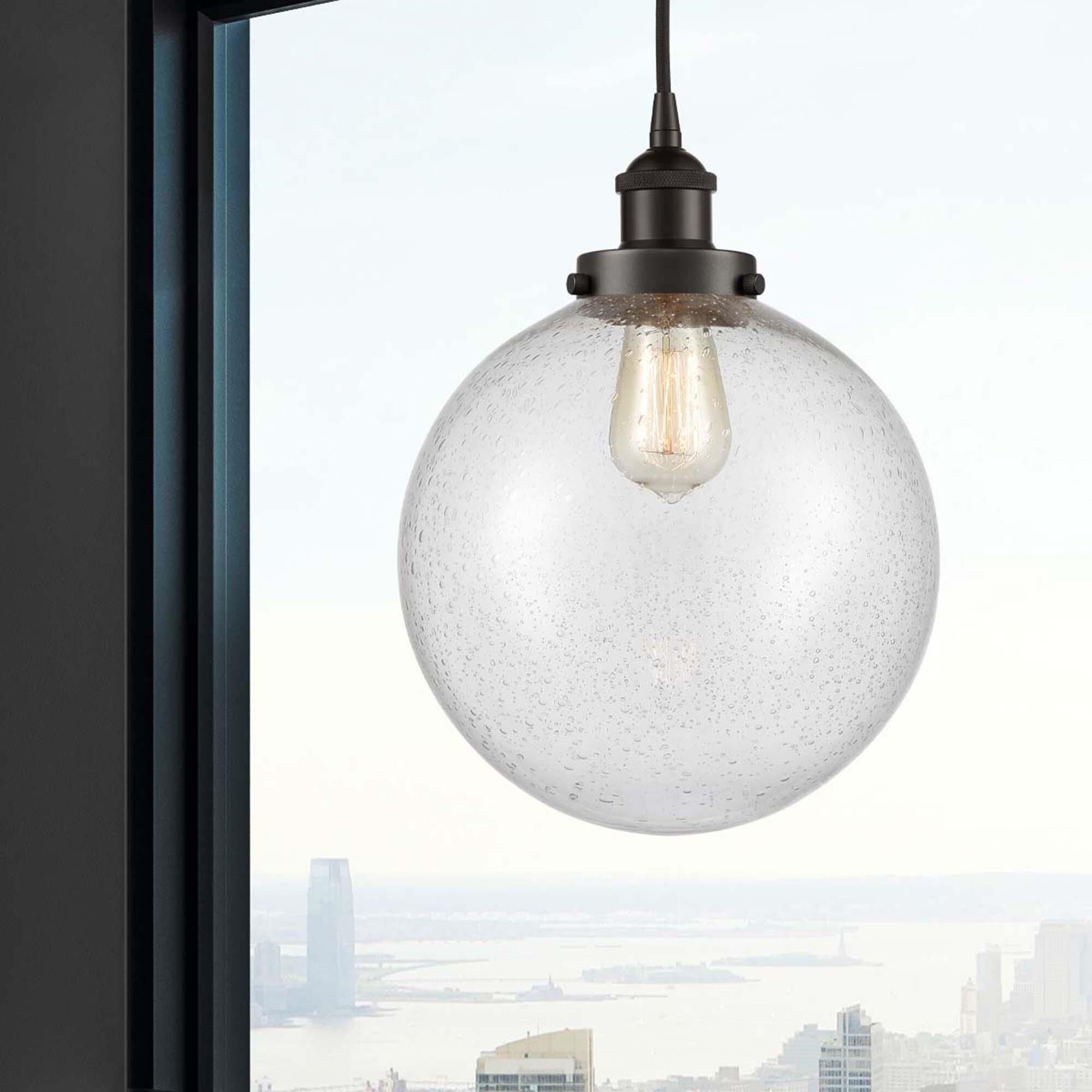 Shown in Oil Rubbed Bronze finish and Seedy Beacon glass