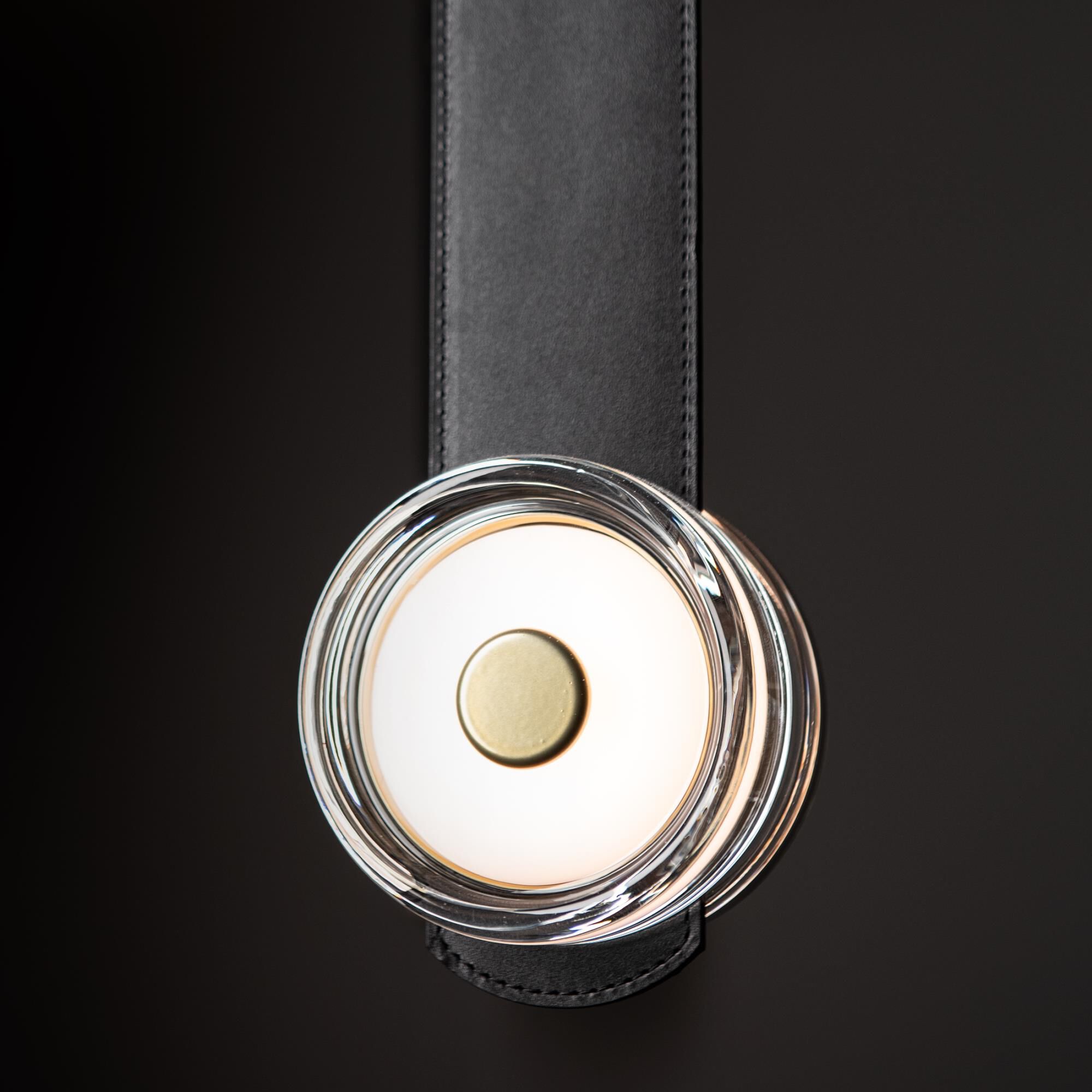 Shown in Modern Brass finish and Clear glass and Black Leather accent