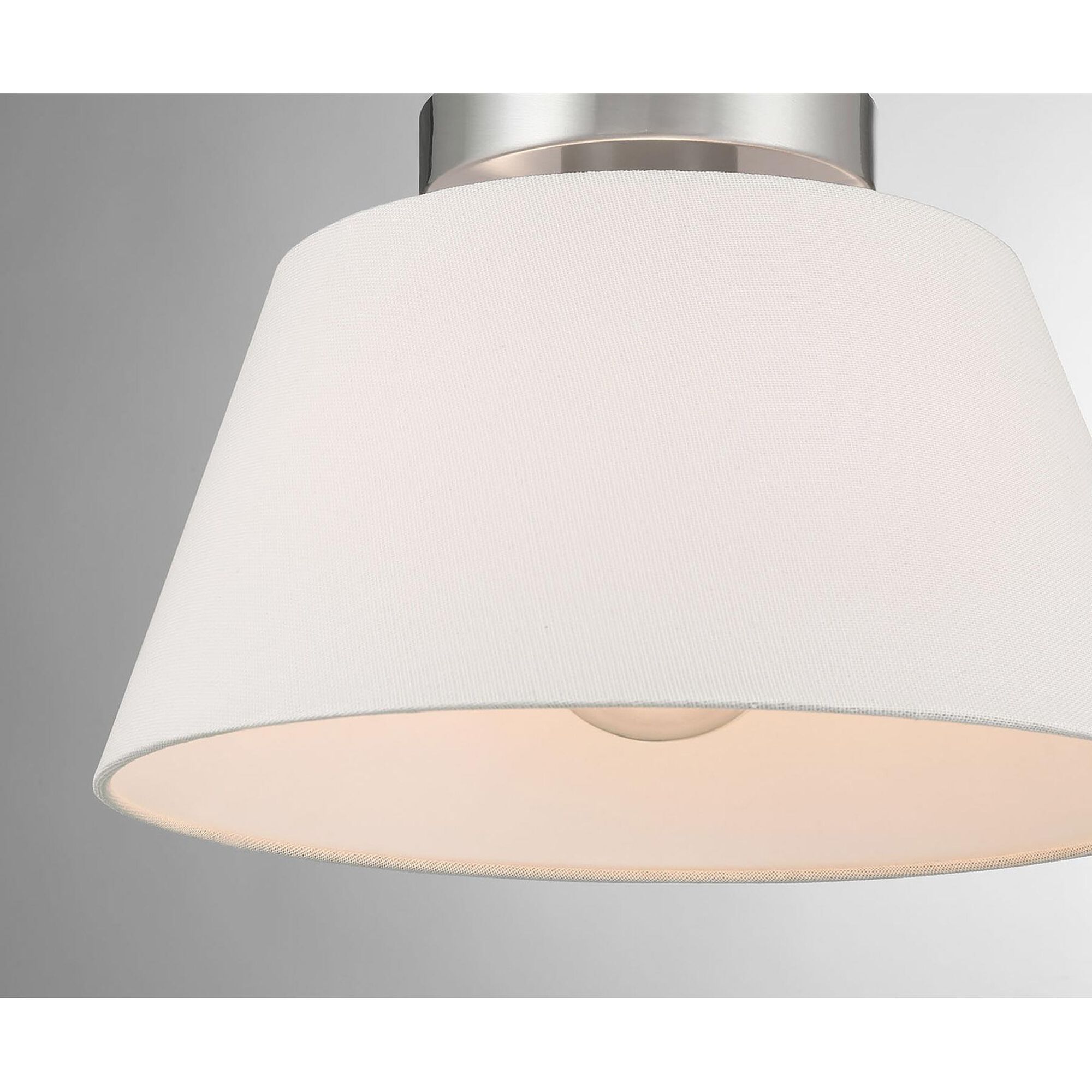 Shown in Brushed Nickel finish and White Linen Fabric shade