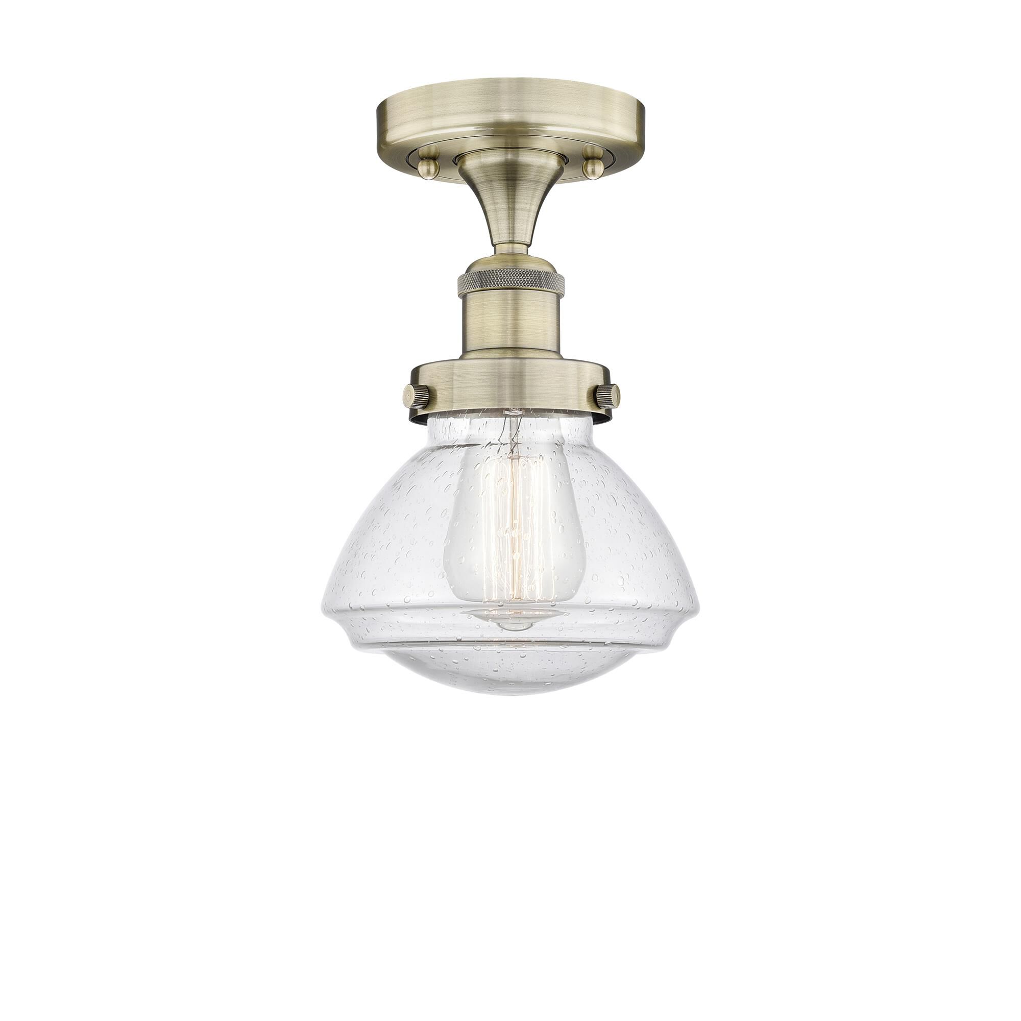 Shown in Antique Brass finish and Seedy glass