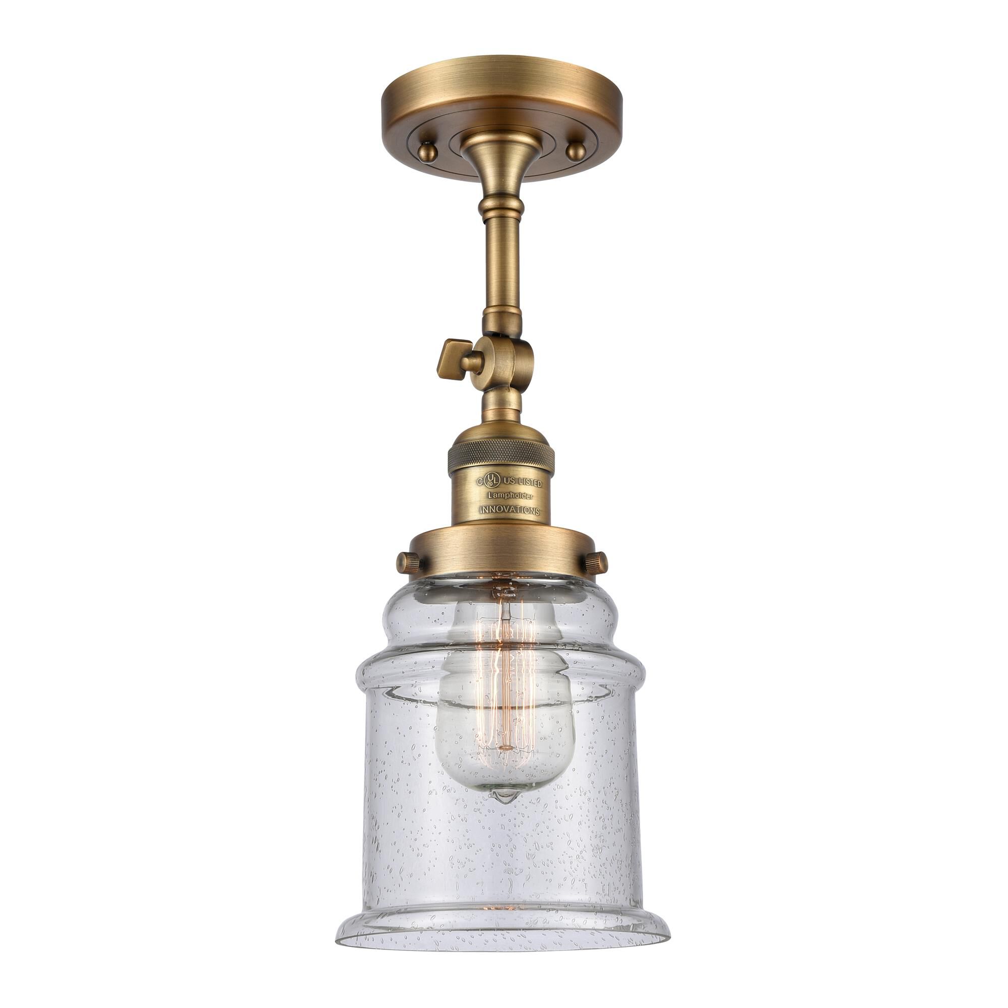 Shown in Brushed Brass finish and Seedy glass and None accent