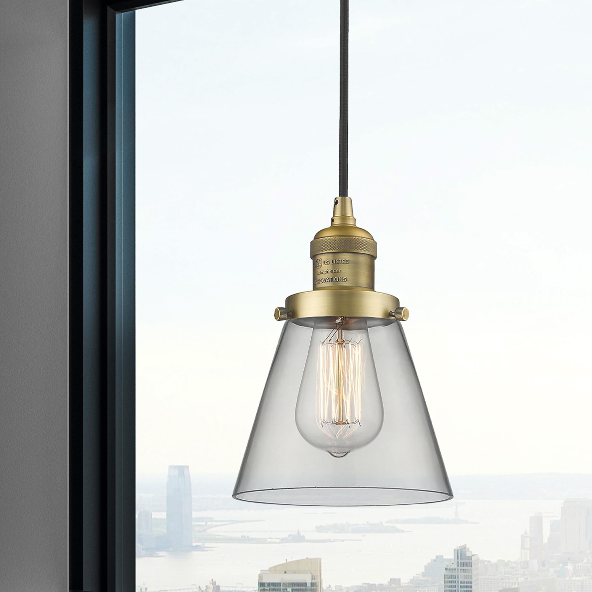 Shown in Brushed Brass finish and Clear glass