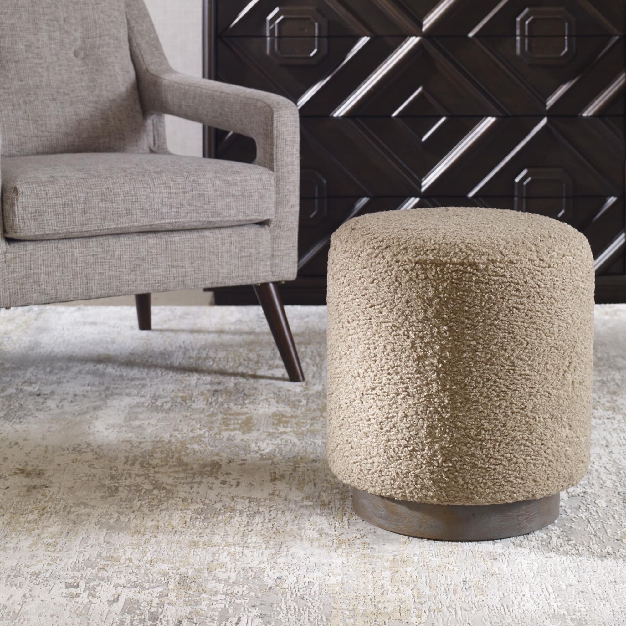 Shown in This Plush Ottoman Is Covered In A Casual Latte Toned Faux Shearling With A Natural Walnut Stained O finish