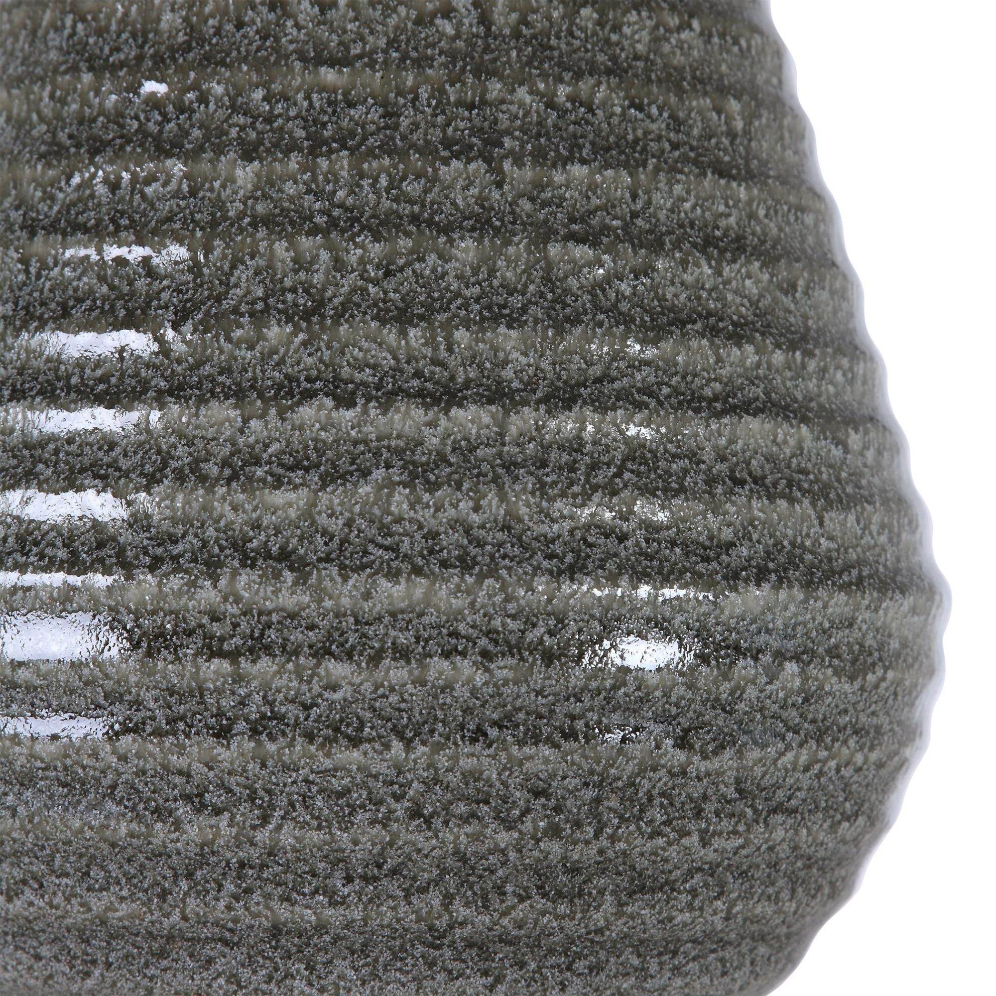 Shown in Showcasing A Tapered Ceramic Base With Ribbed Texture, This Transitional Table Lamp Is Finished In A finish and Round Hardback Drum shade