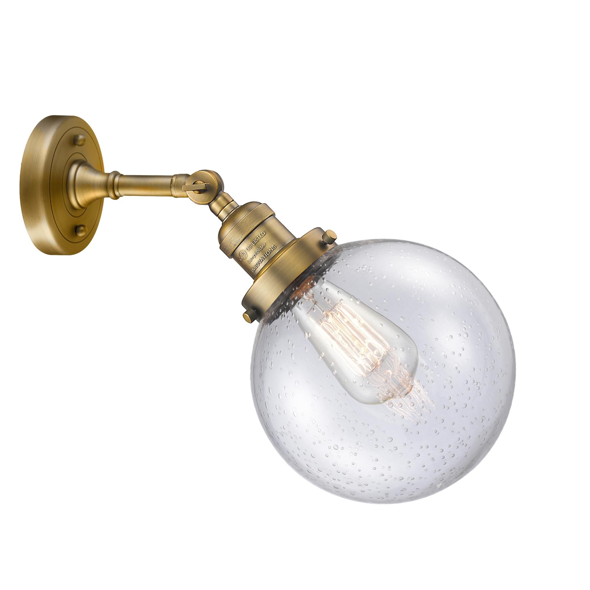 Shown in Brushed Brass finish and Seedy glass and No Accent accent