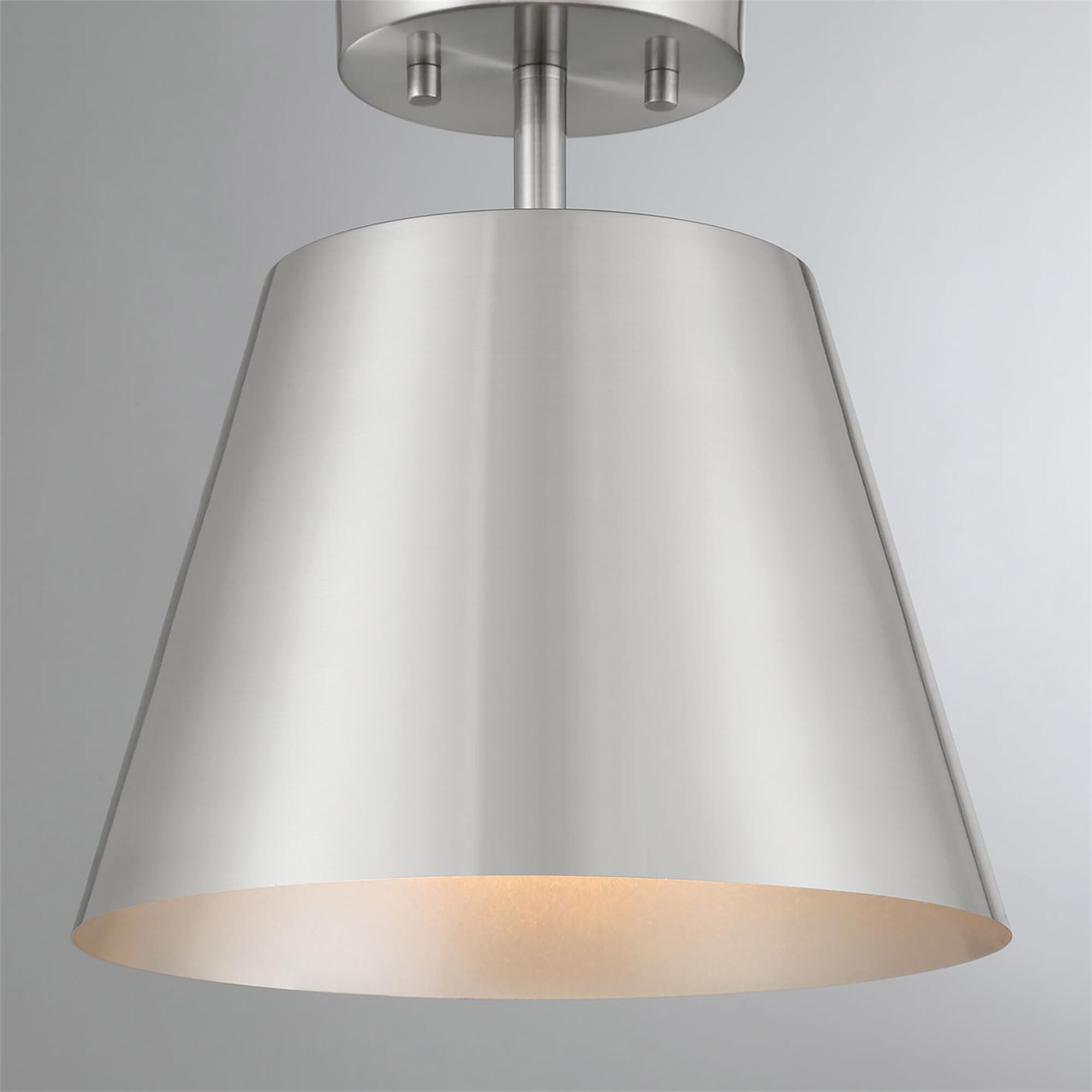 Shown in Brushed Nickel finish and Metal shade