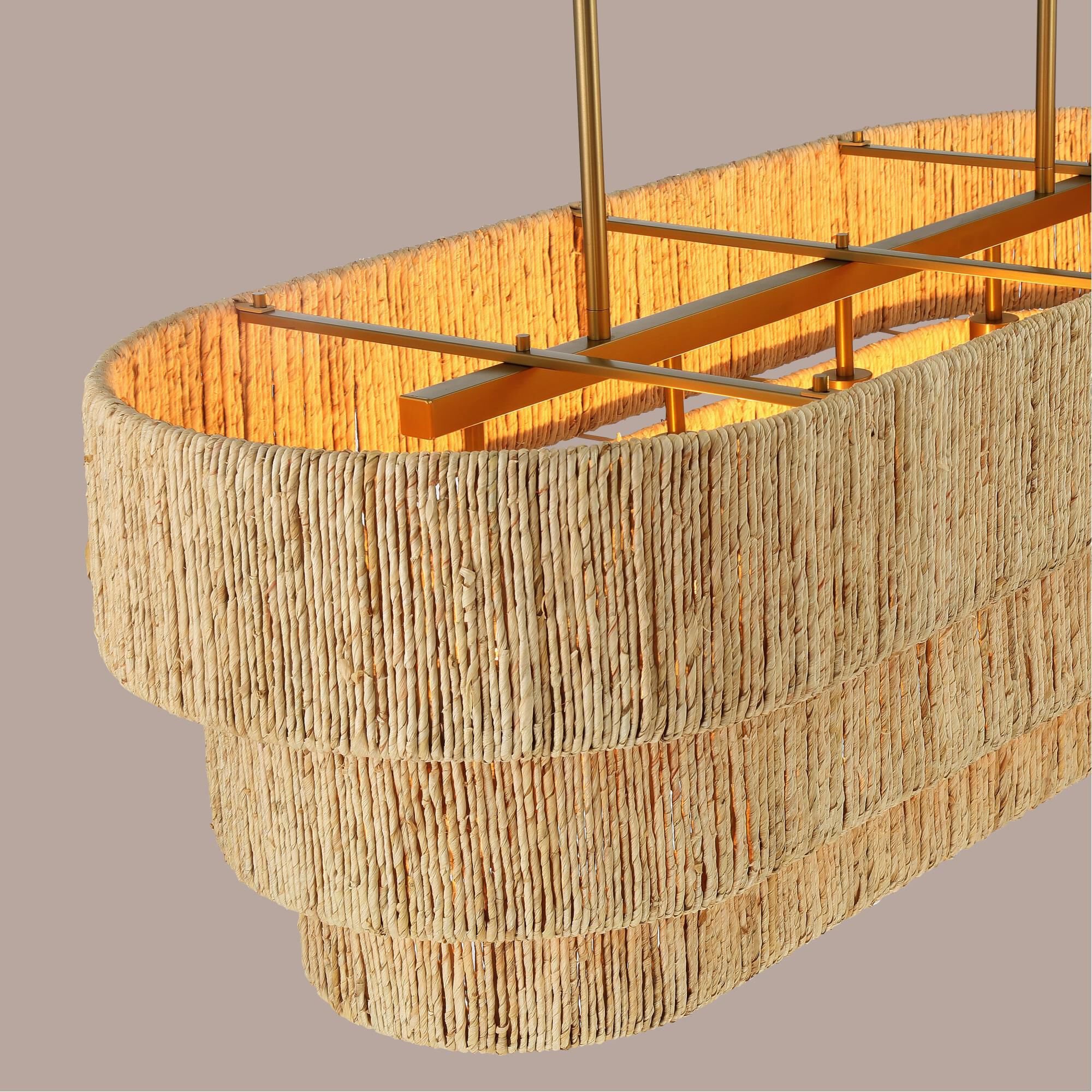 Shown in Signature Brass finish and Natural Abaca shade
