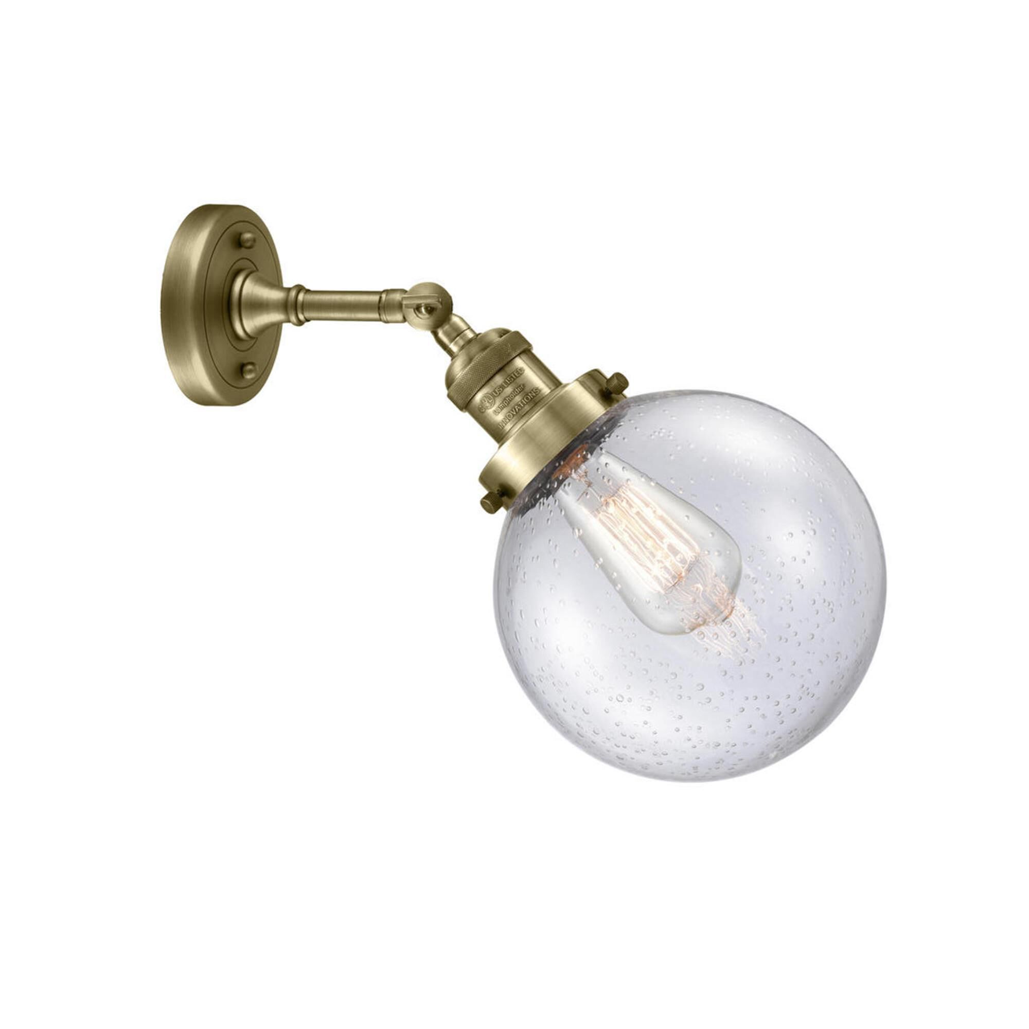Shown in Antique Brass finish and Seedy glass and No Accent accent