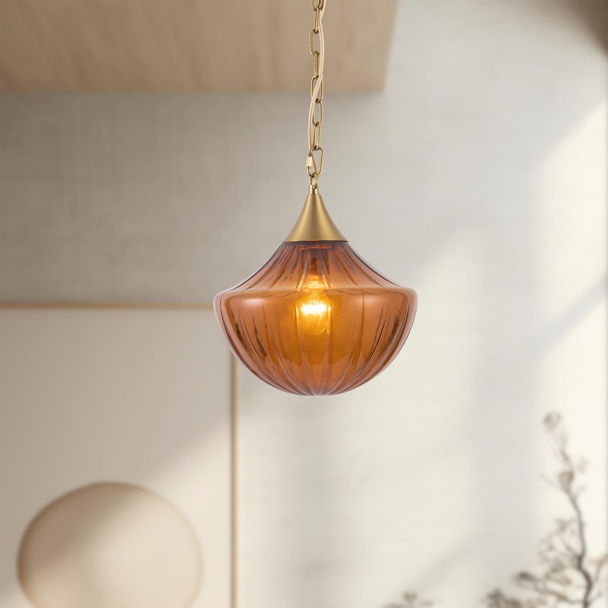 Shown in Brushed Gold finish and Amber Ribbed glass
