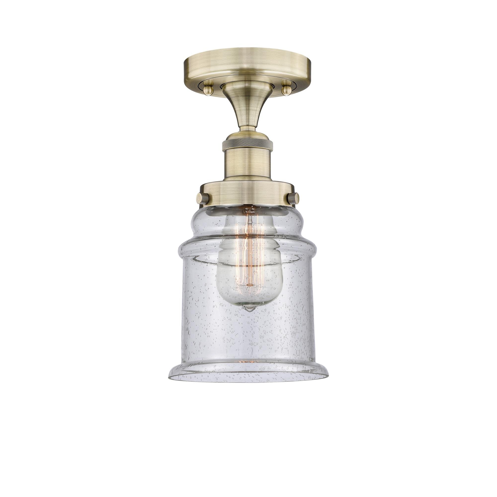 Shown in Antique Brass finish and Seedy glass