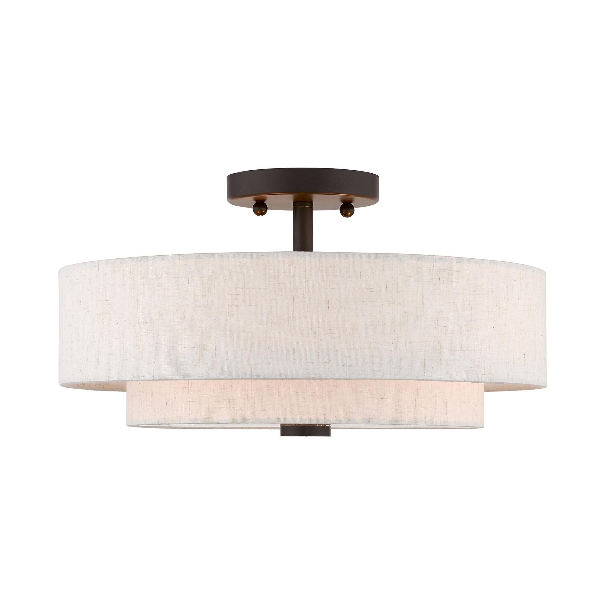 Shown in English Bronze finish and Hand Crafted Oatmeal Color Fabric Outside & White Fabric Inside Hardback shade