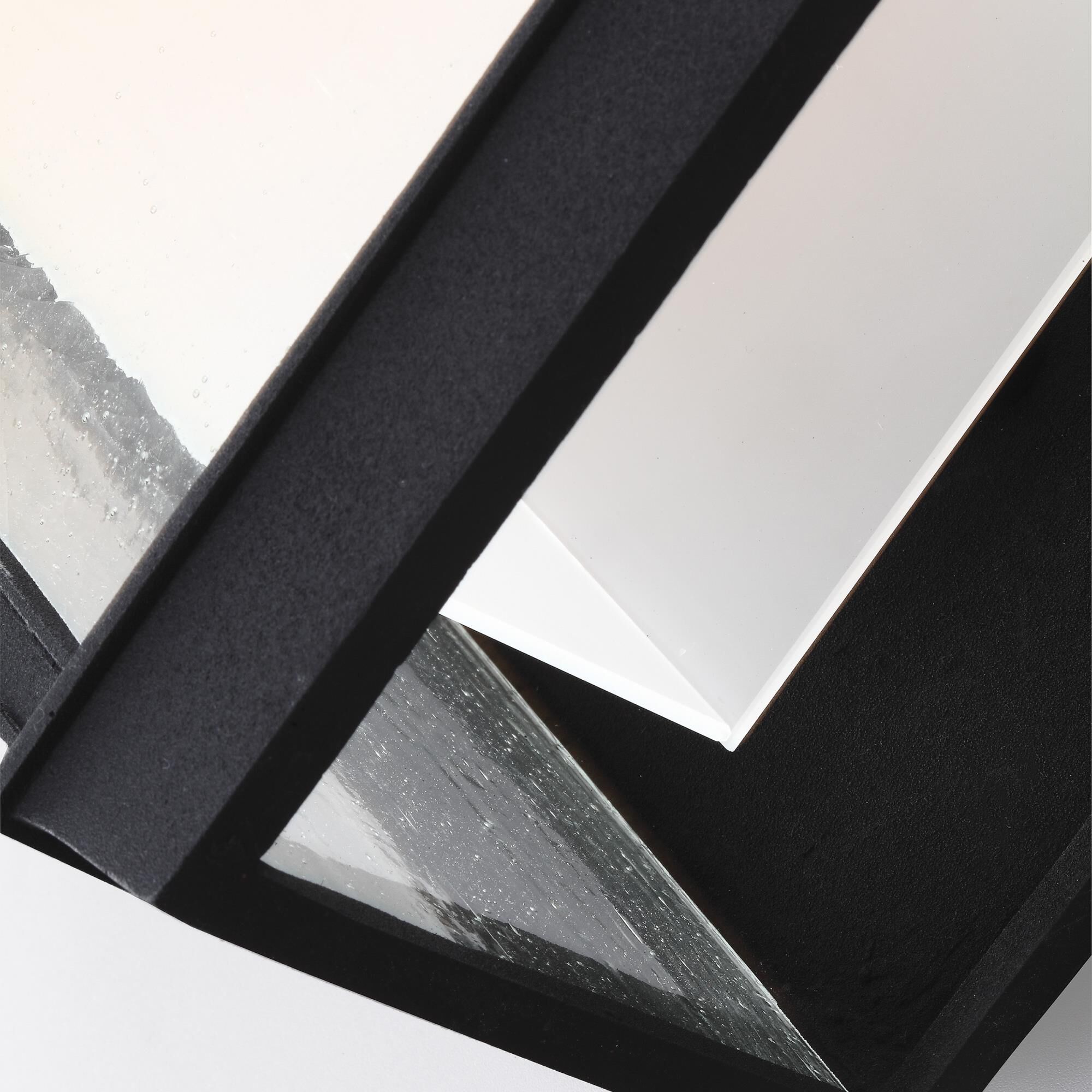 Shown in Textured Black finish and Clear Seeded Panels glass