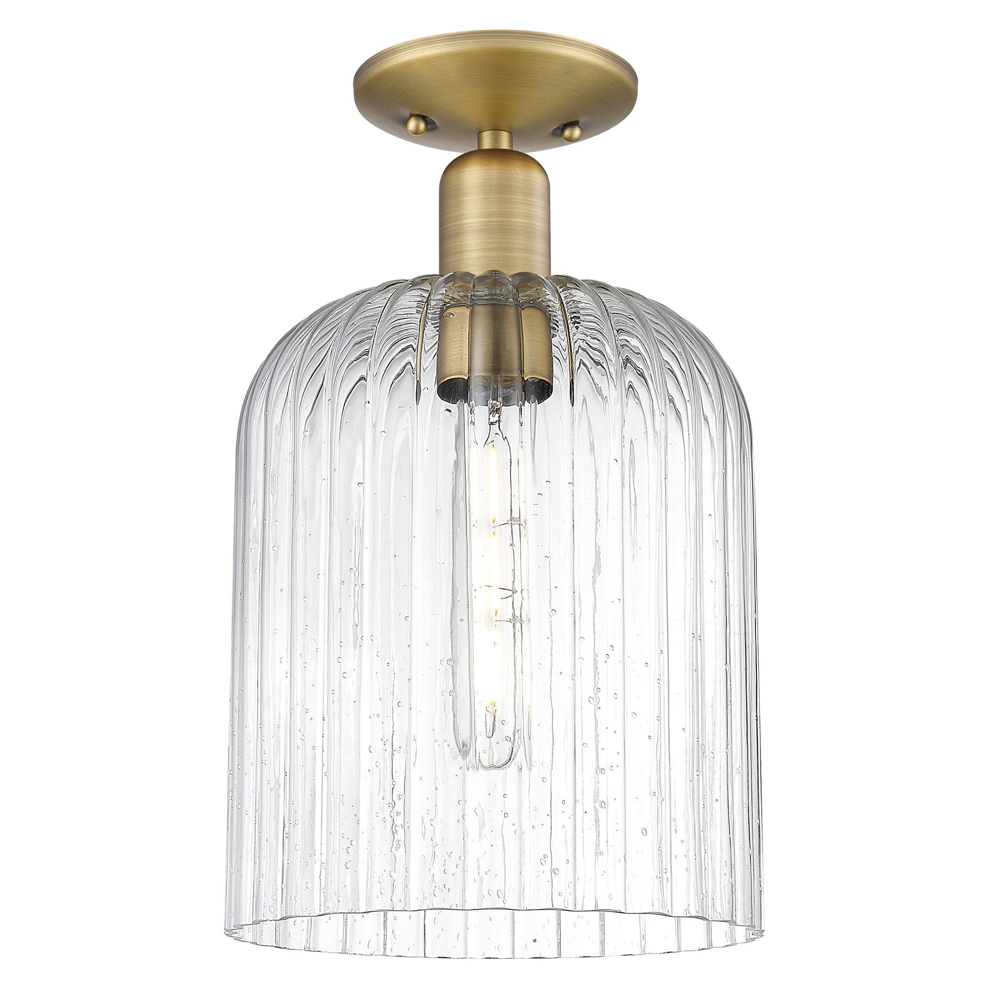 Shown in Brushed Brass finish and Seedy glass