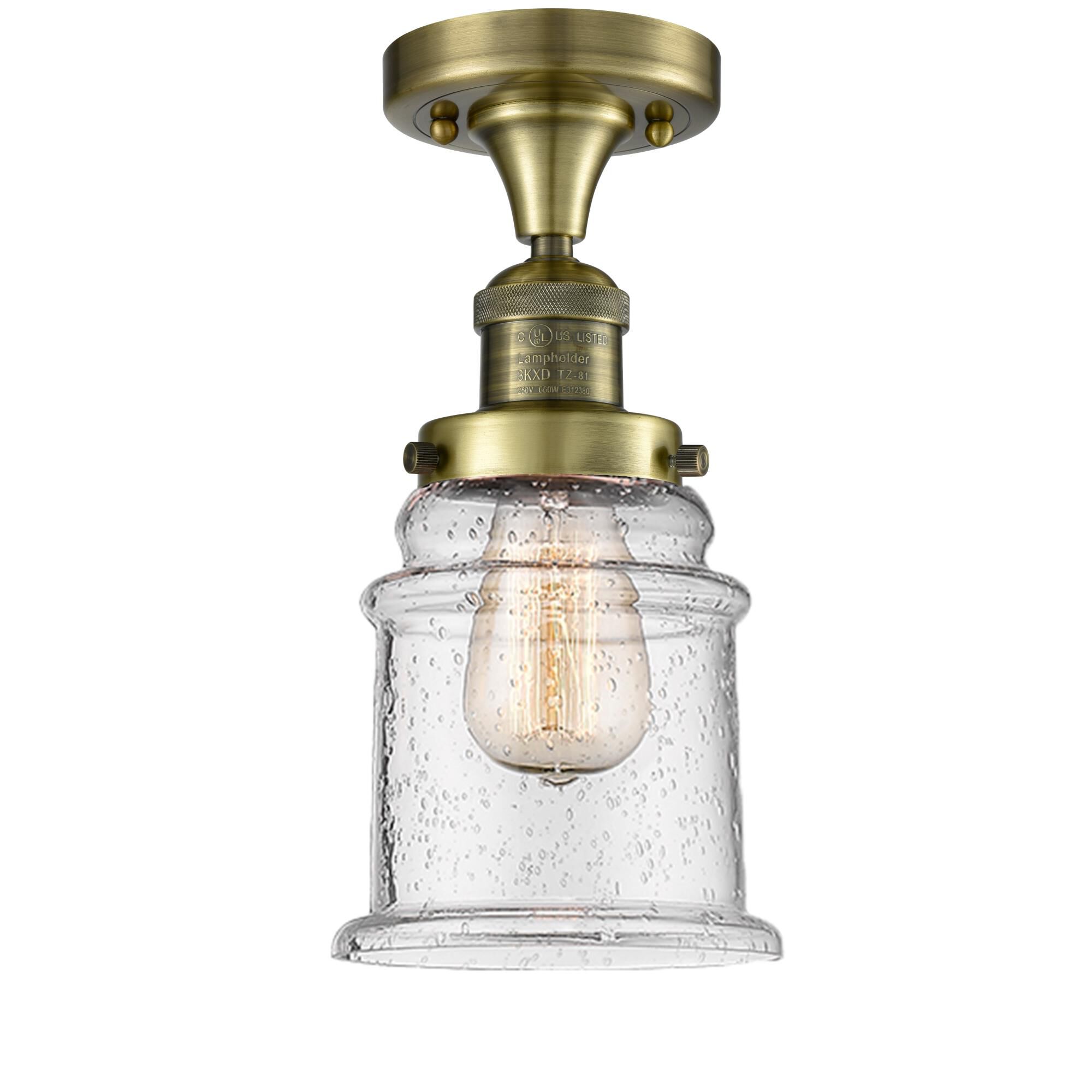 Shown in Antique Brass finish and Seedy glass