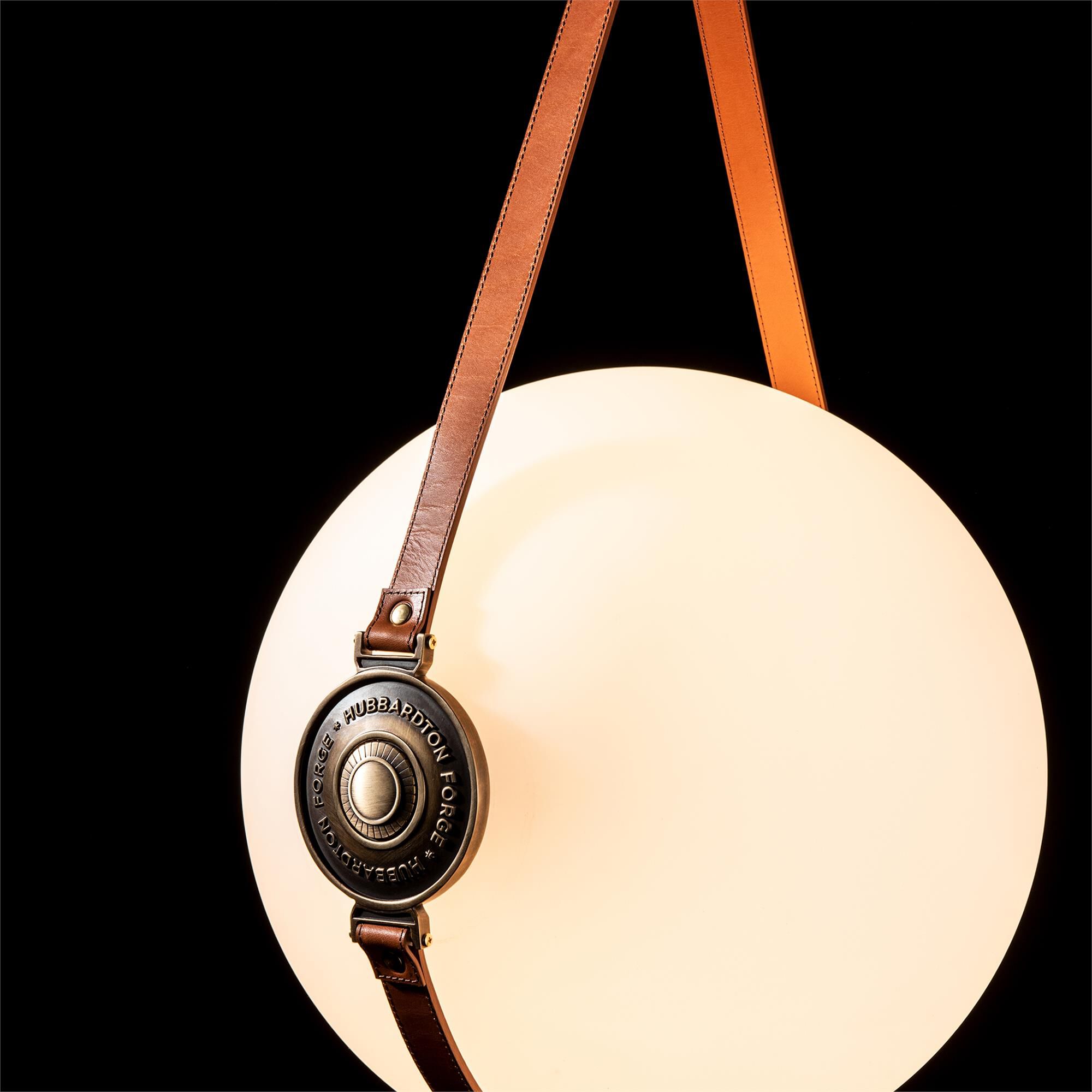 Shown in Brass with Black finish and Opal glass and Leather Chestnut accent