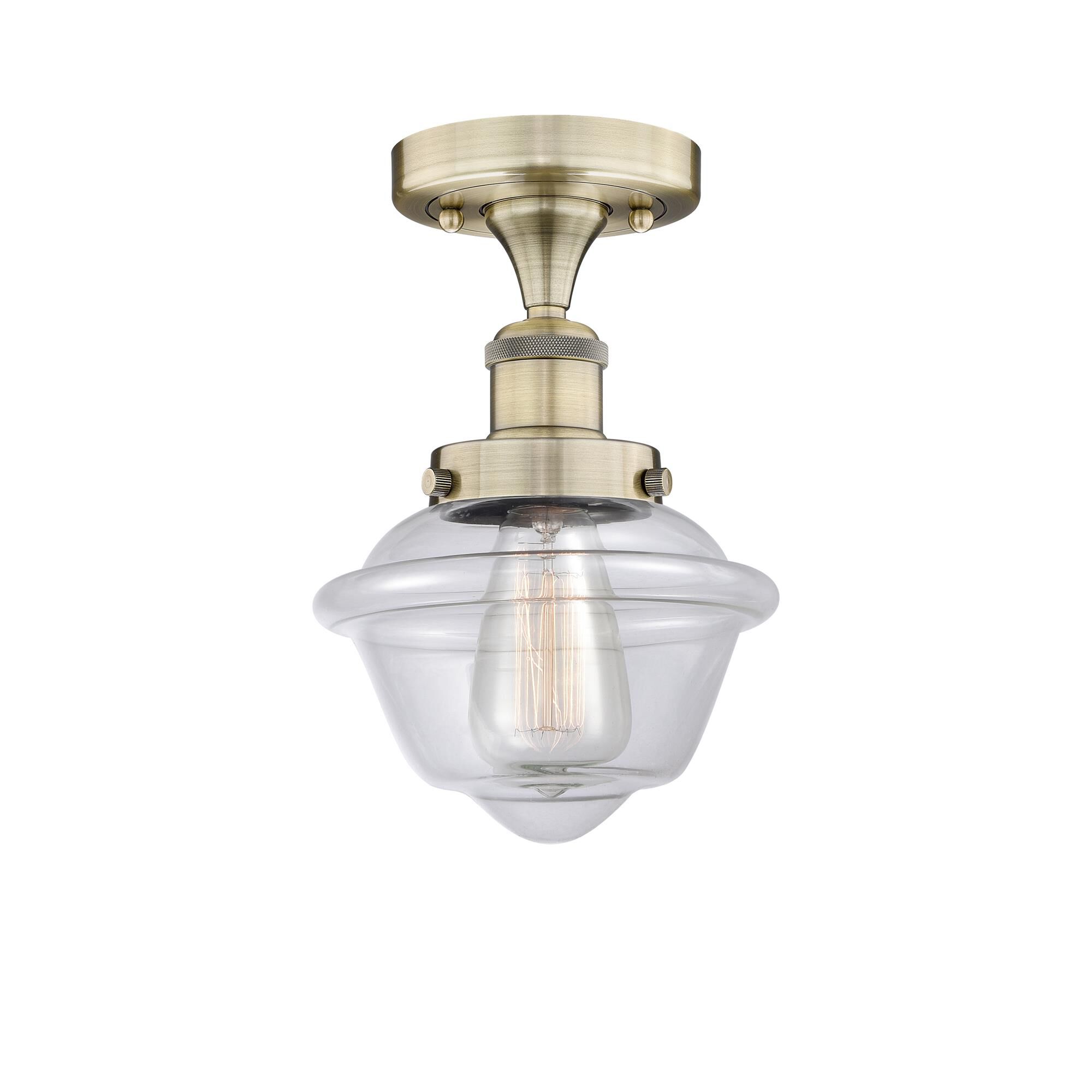 Shown in Antique Brass finish and Clear glass