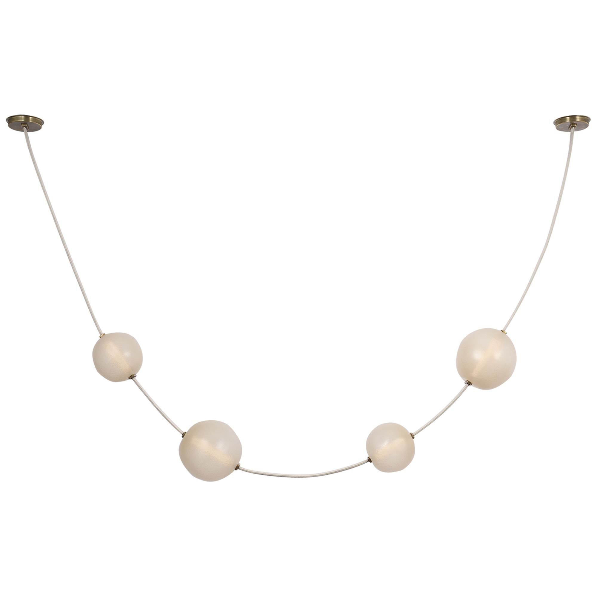 Shown in Bone Suede And Mottled Brass finish and Fizzy Nude glass