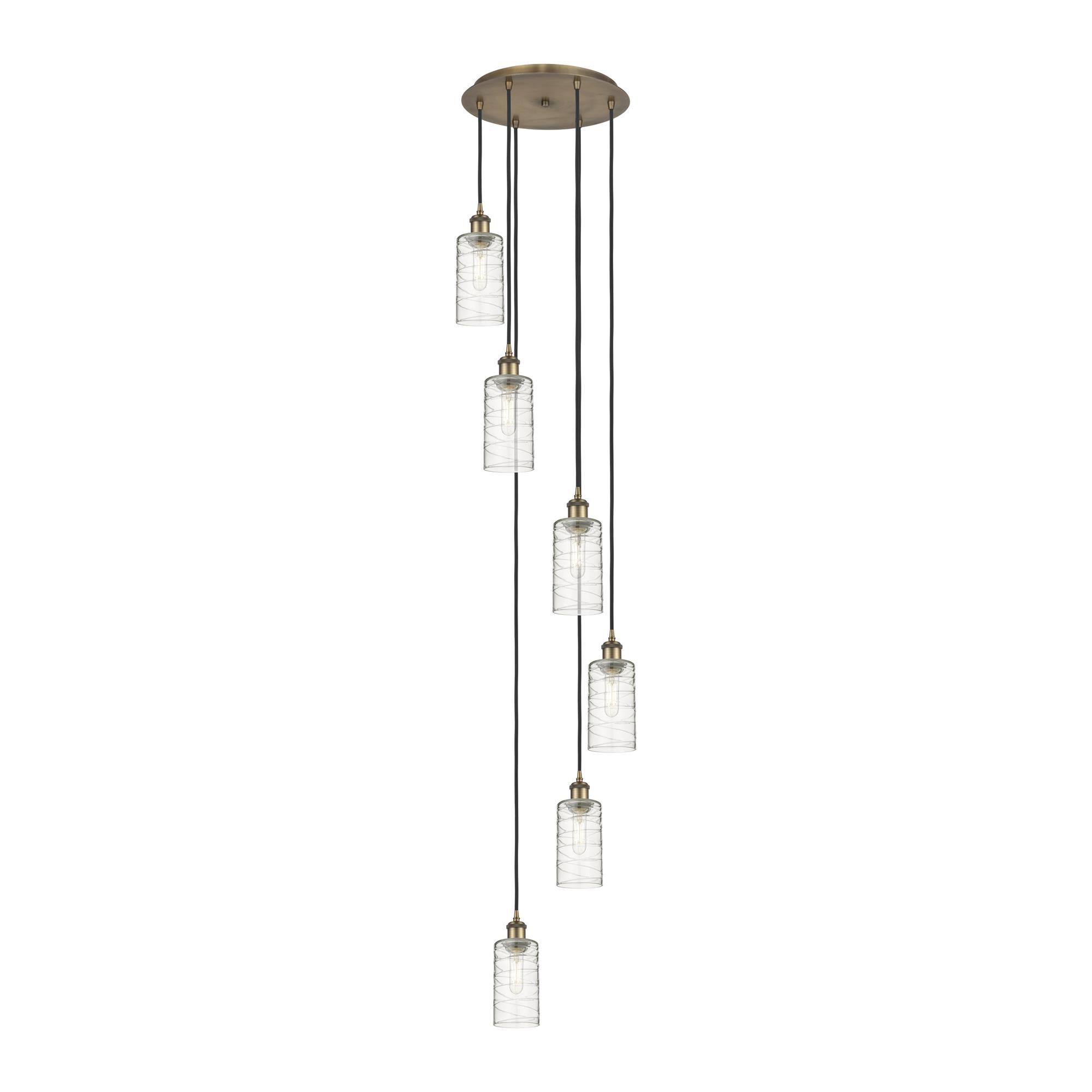 Shown in Brushed Brass finish and Deco Swirl shade