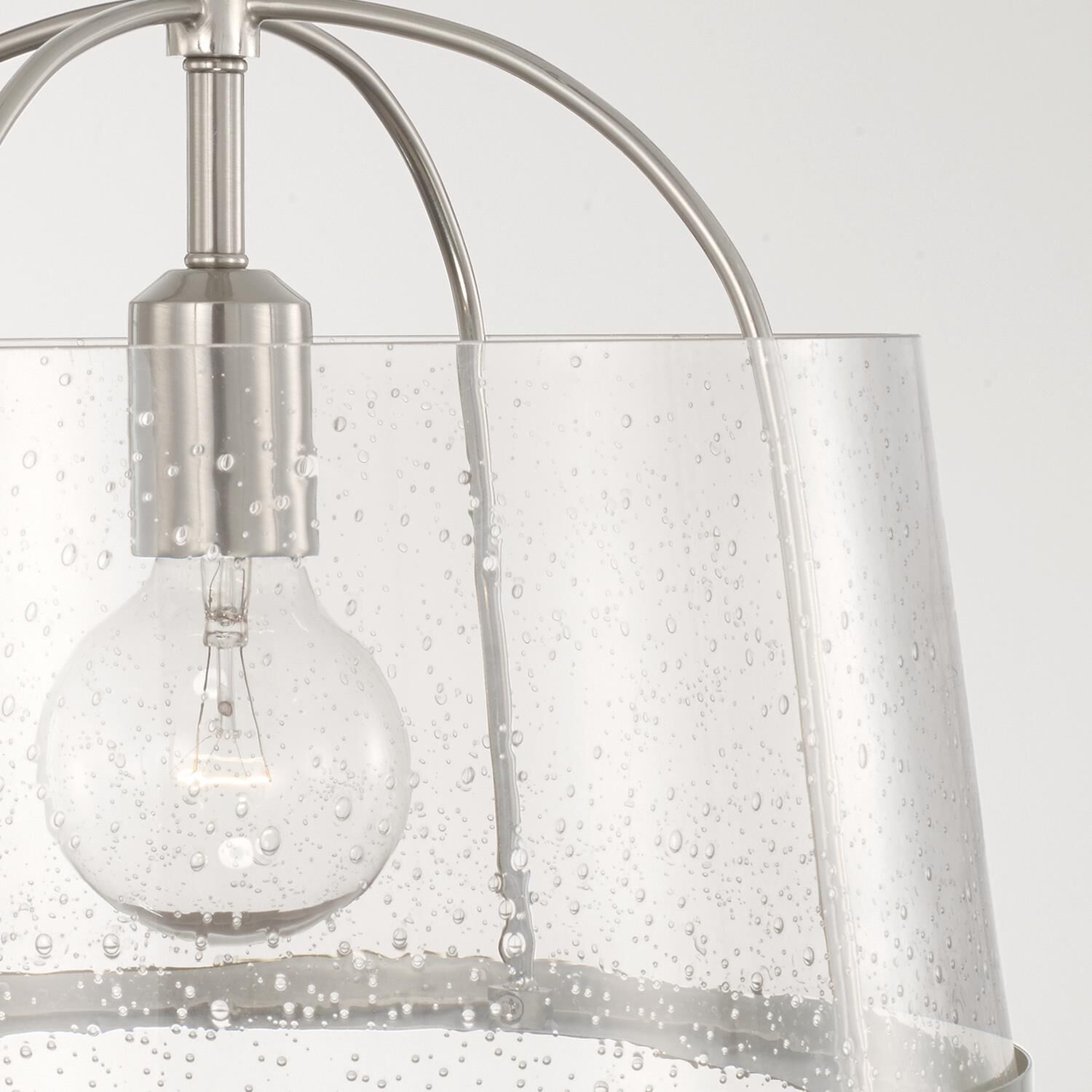 Shown in Brushed Nickel finish and Clear Seeded glass