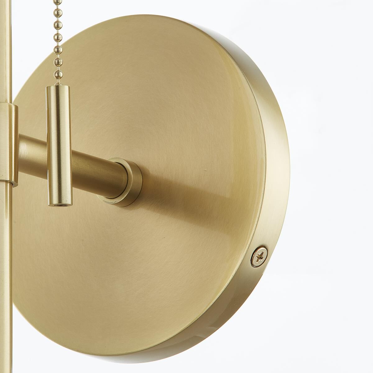 Shown in Aged Brass finish and White Linen shade