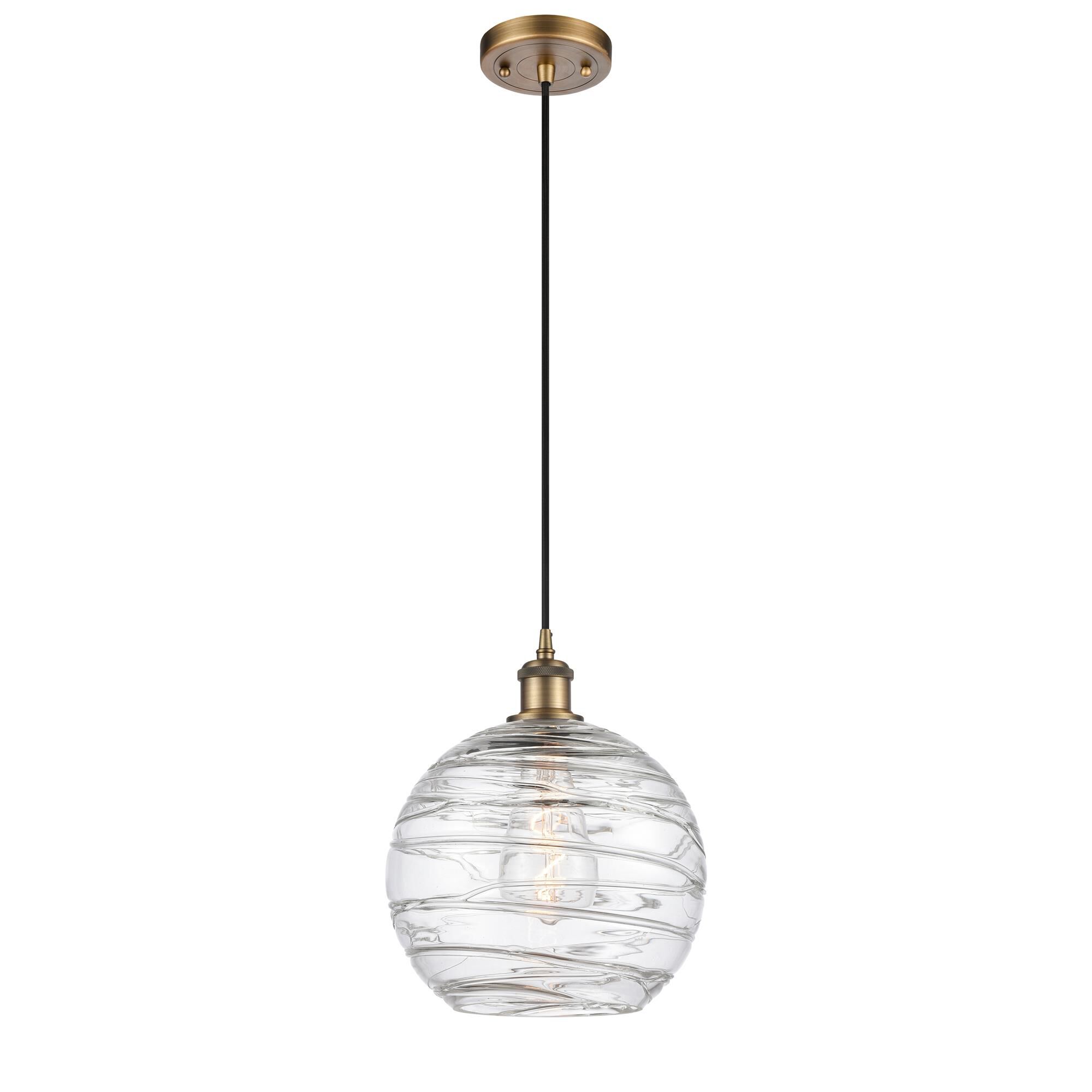 Shown in Brushed Brass finish and Clear Large Deco Swirl glass