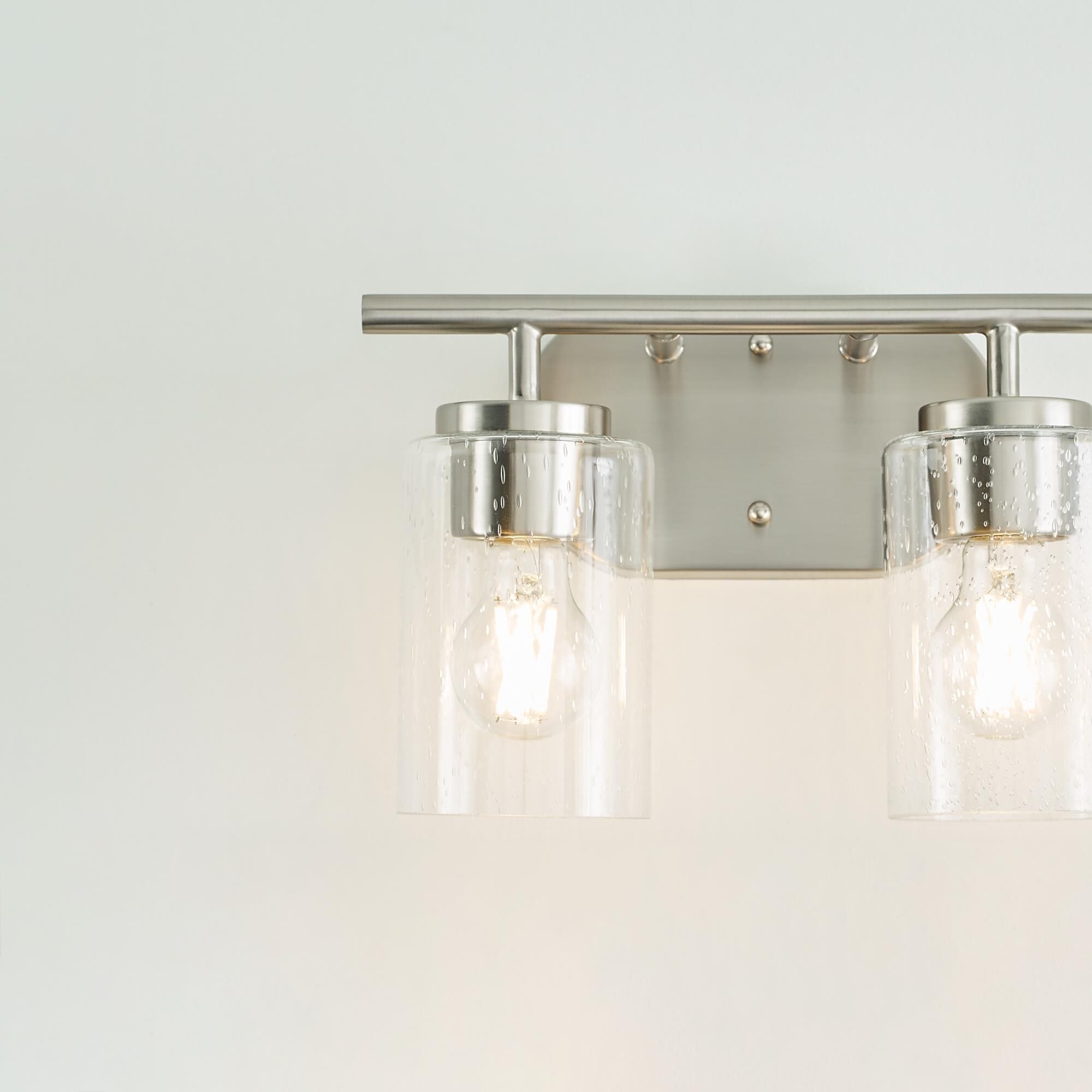 Shown in Brushed Nickel finish and Clear Seeded glass