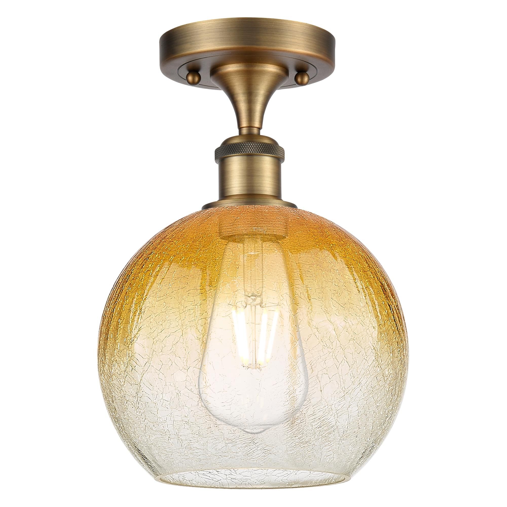 Shown in Brushed Brass finish and Amber glass