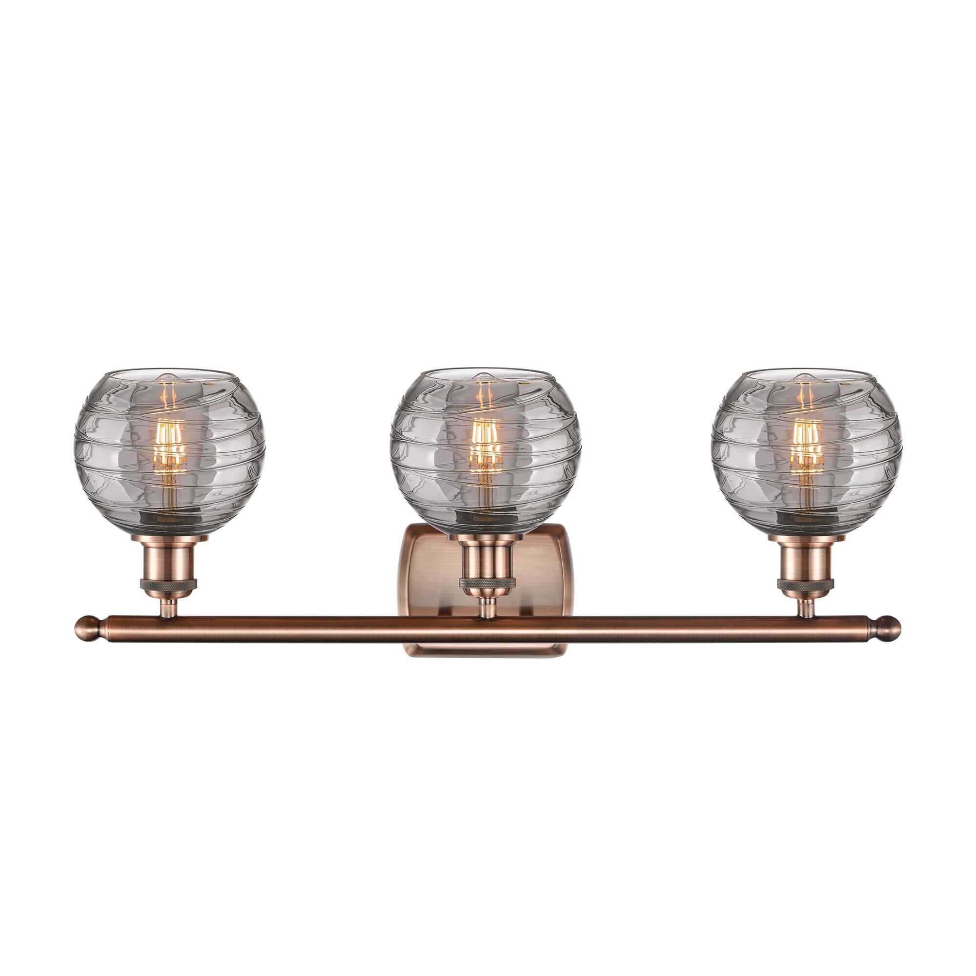 Shown in Antique Copper finish and Light Smoke Deco Swirl glass