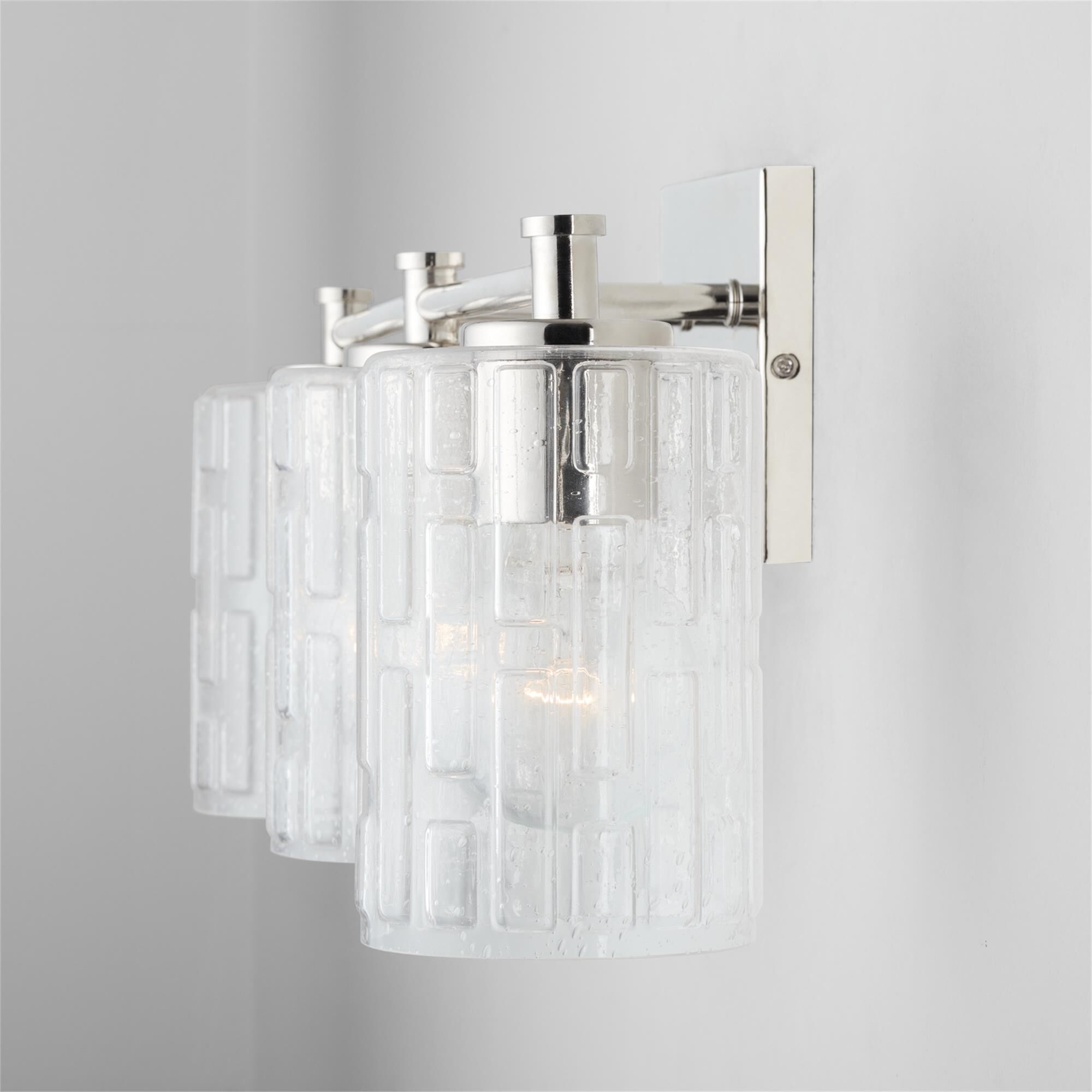 Shown in Polished Nickel finish and Clear Embossed glass