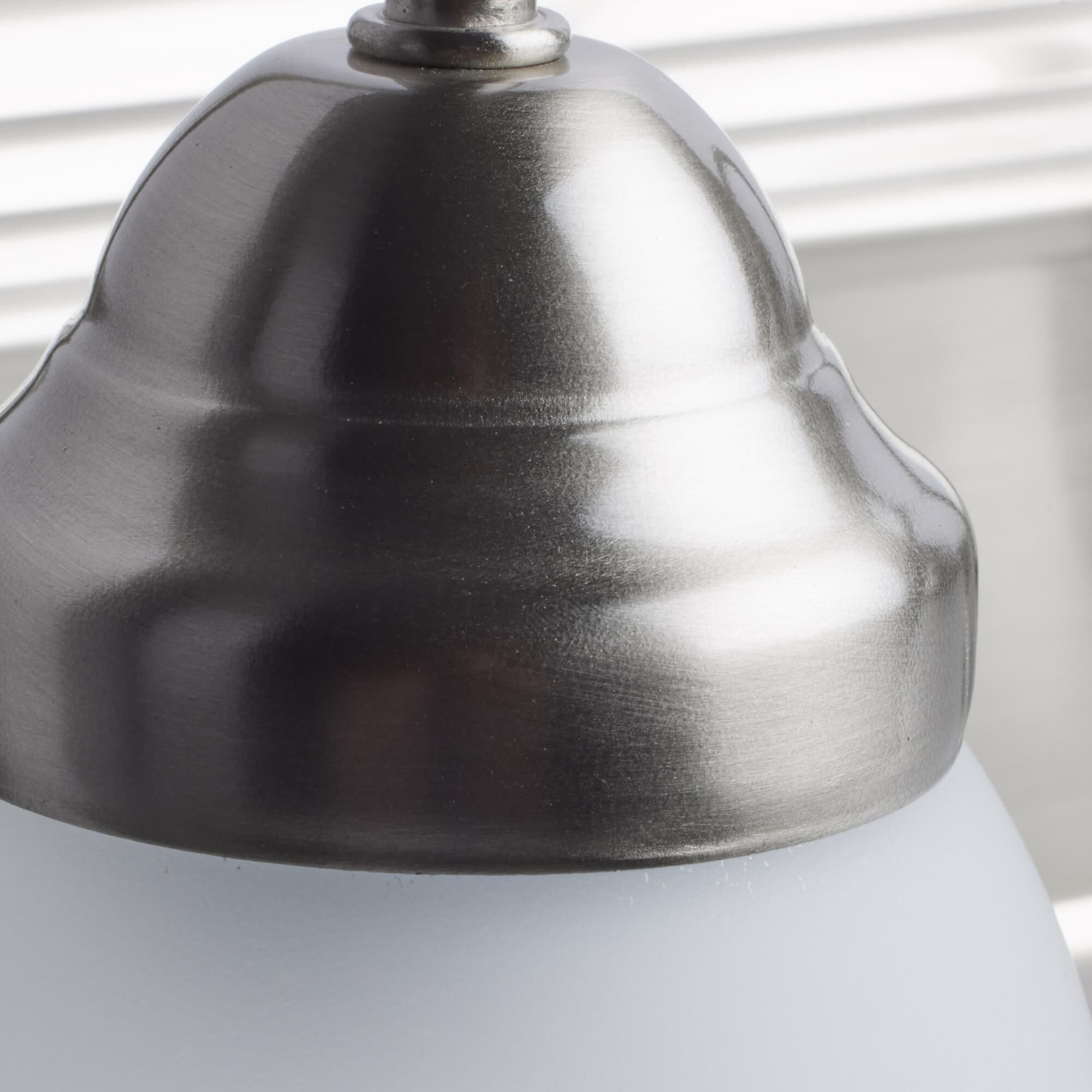 Shown in Brushed Nickel finish and Frosted White glass