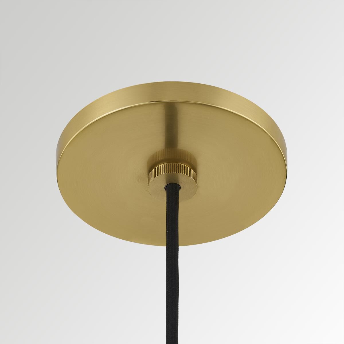 Shown in Aged Brass finish and Glossy White Metal shade