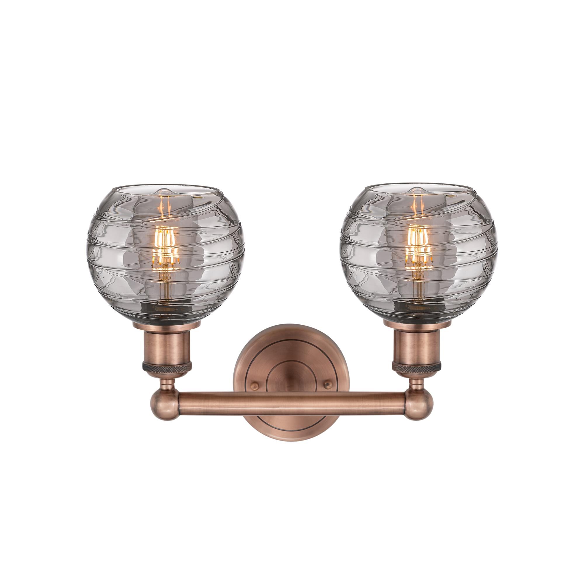 Shown in Antique Copper finish and Light Smoke Deco Swirl glass