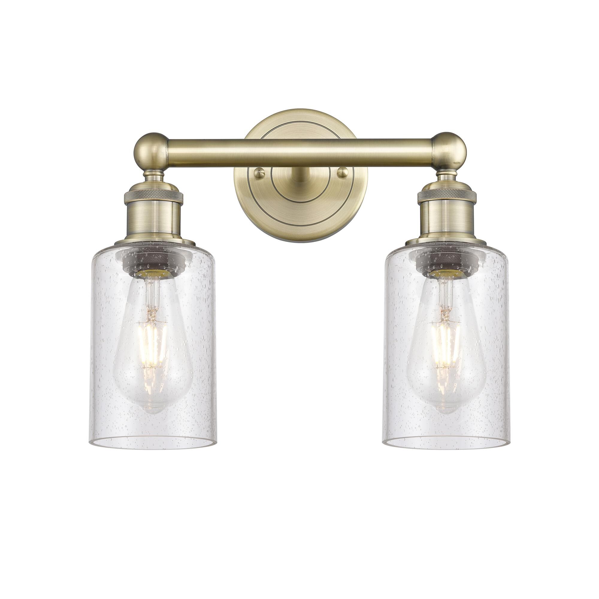 Shown in Antique Brass finish and Seedy glass