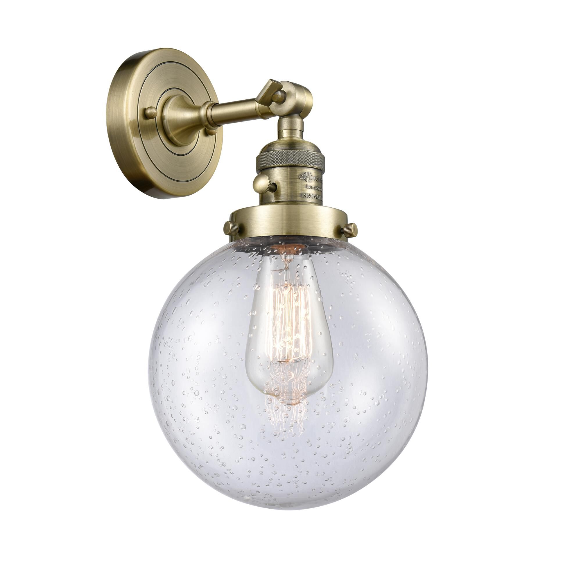 Shown in Antique Brass finish and Seedy glass and Switch on Socket accent