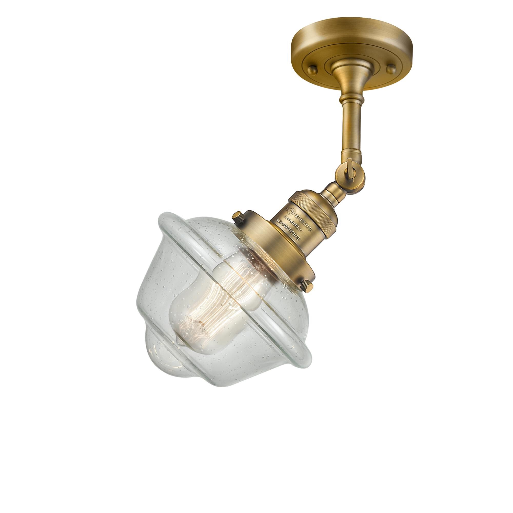Shown in Brushed Brass finish and Seedy glass