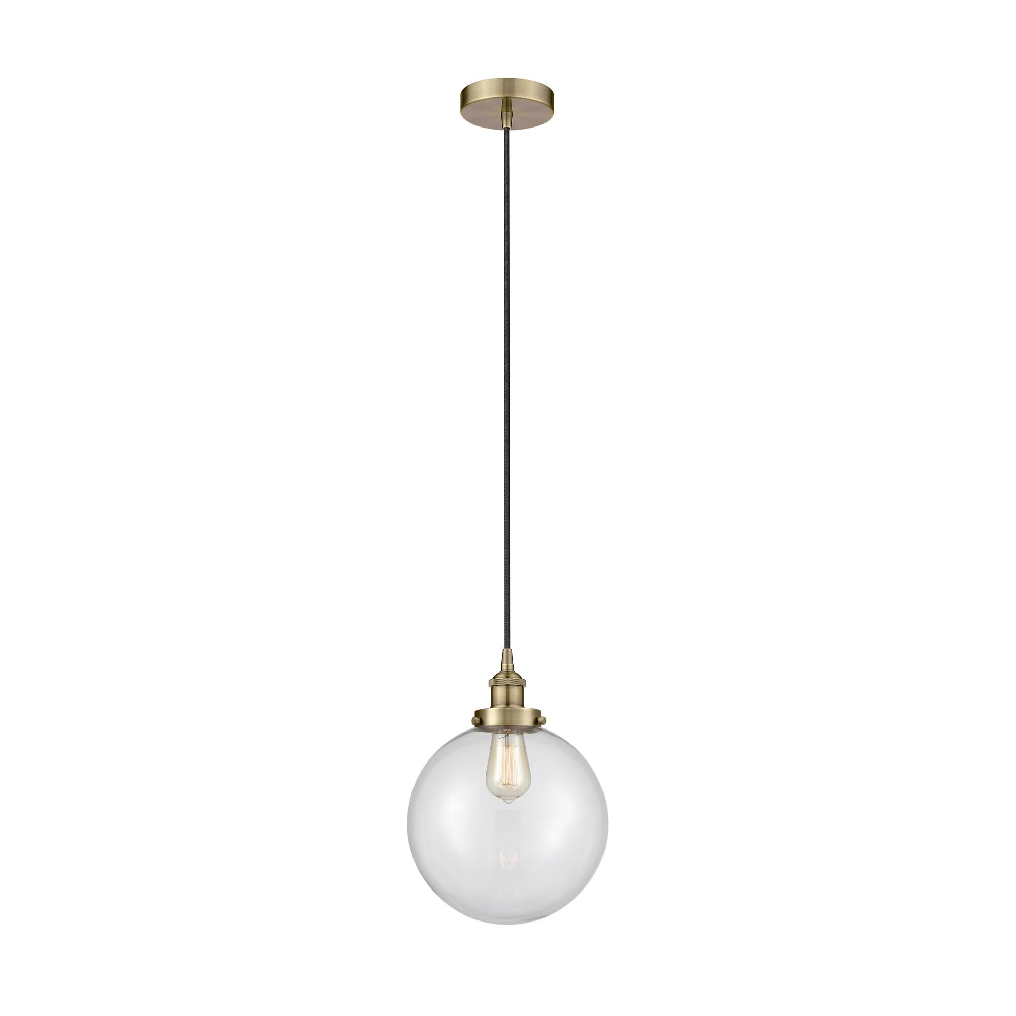 Shown in Antique Brass finish and Clear Beacon glass