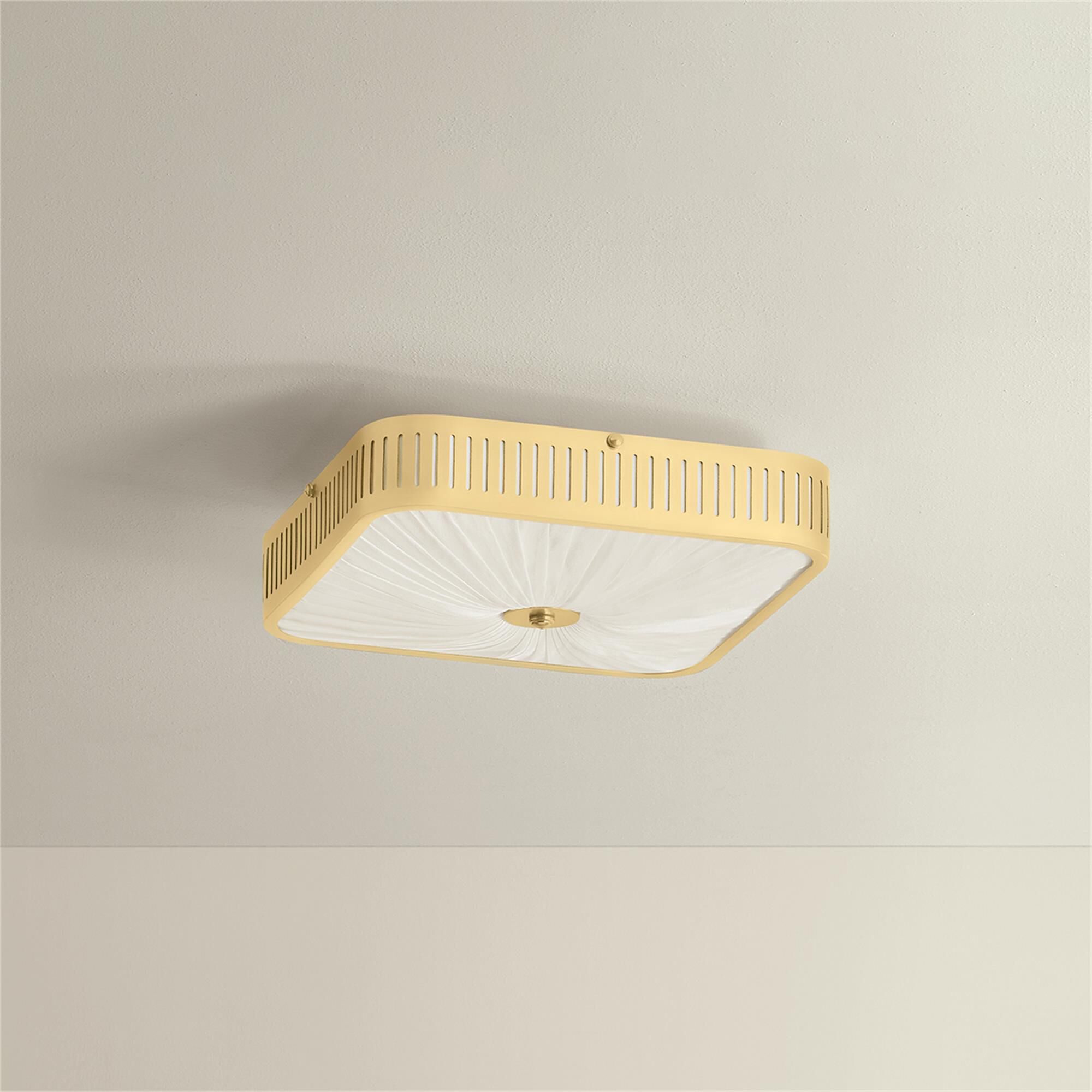 Shown in Aged Brass finish and Ivory Silk shade