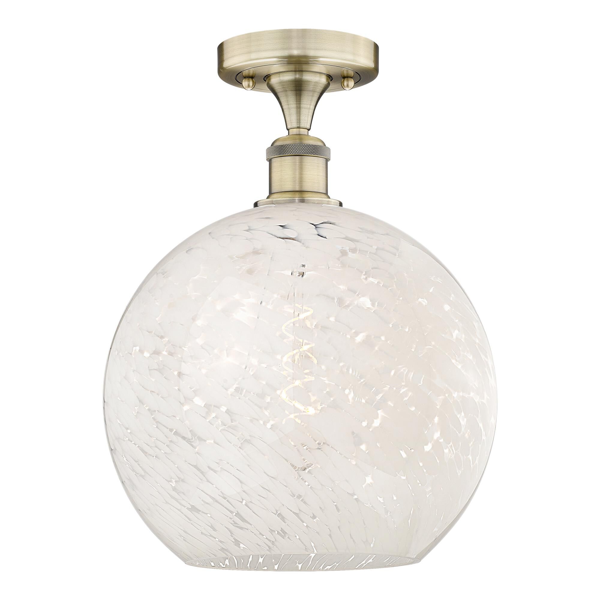Shown in Antique Brass finish and White Mouchette glass