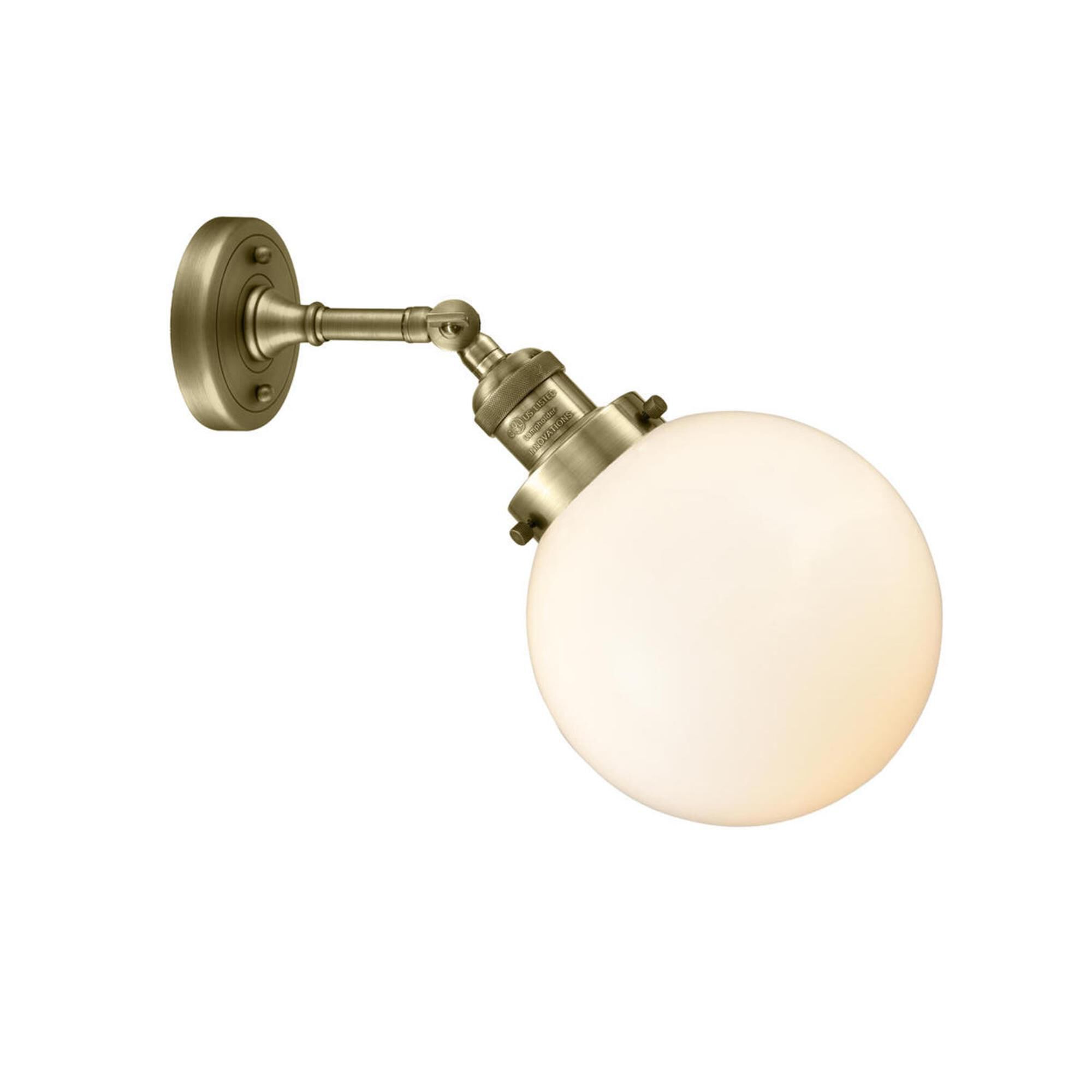 Shown in Antique Brass finish and Matte White Cased glass and No Accent accent