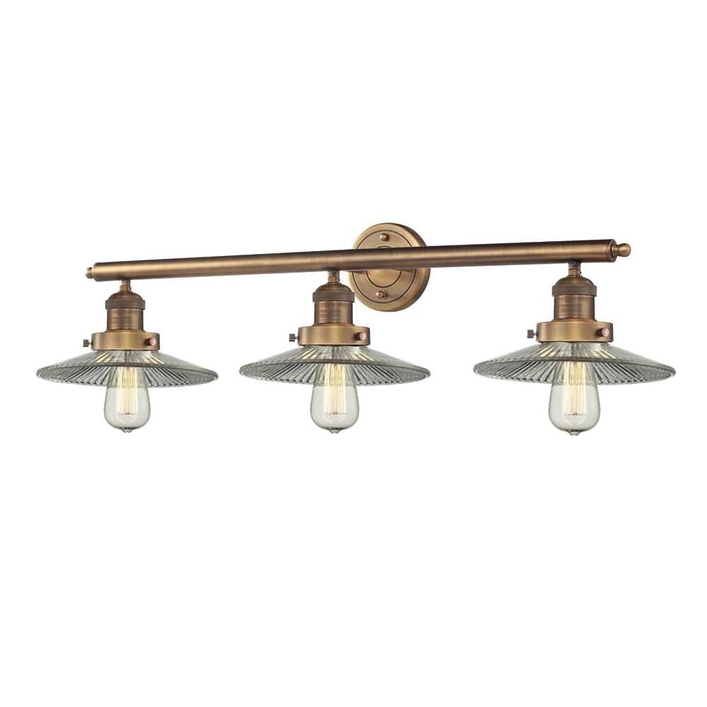 Shown in Brushed Brass finish and Clear Halophane glass