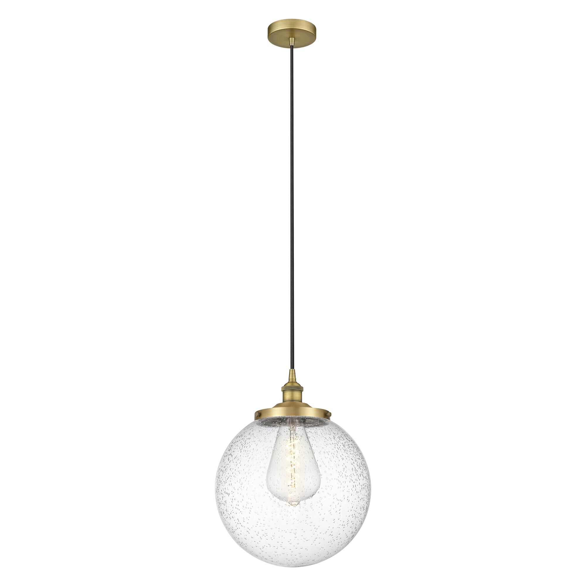 Shown in Brushed Brass finish and Seedy glass