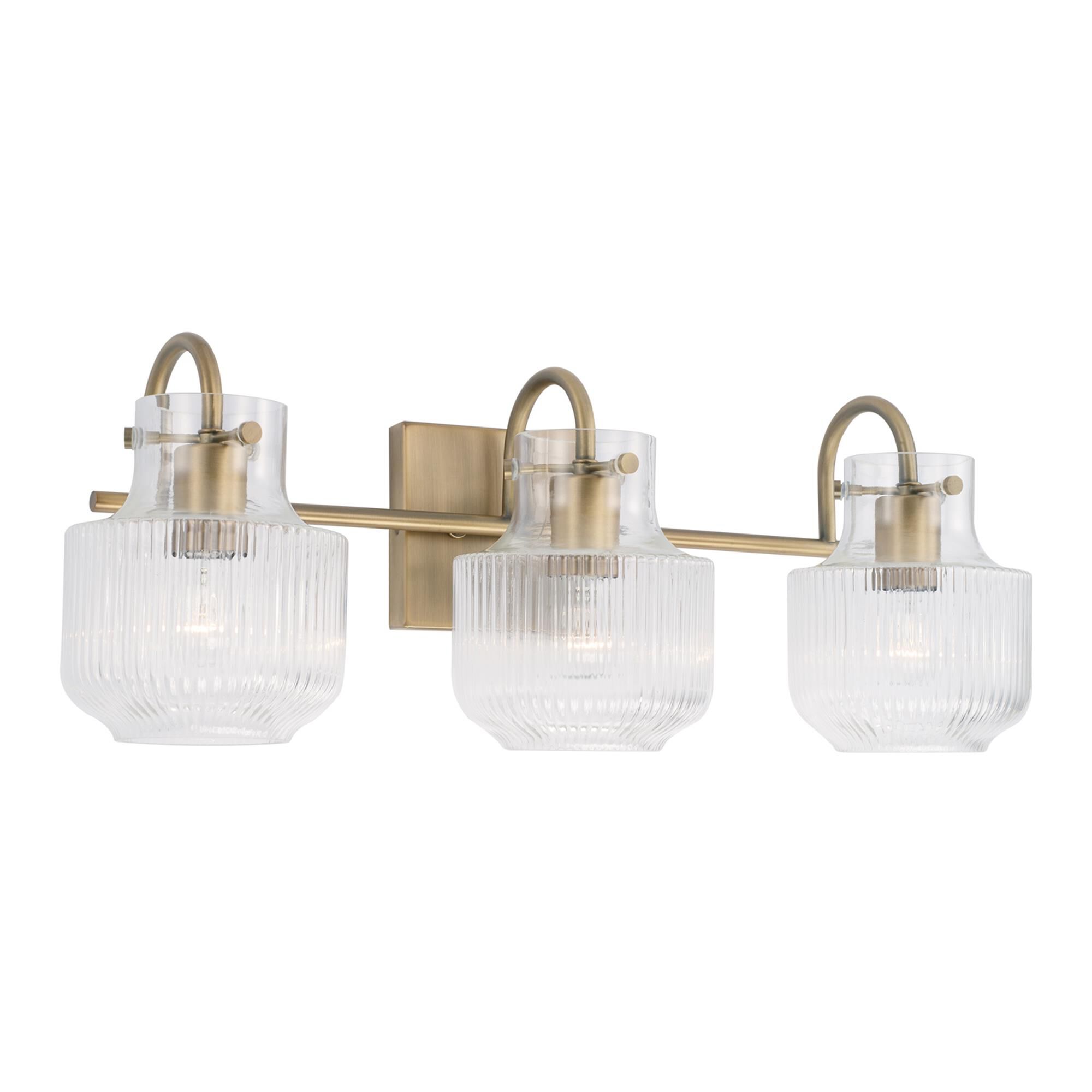 Shown in Aged Brass finish and Clear Fluted glass