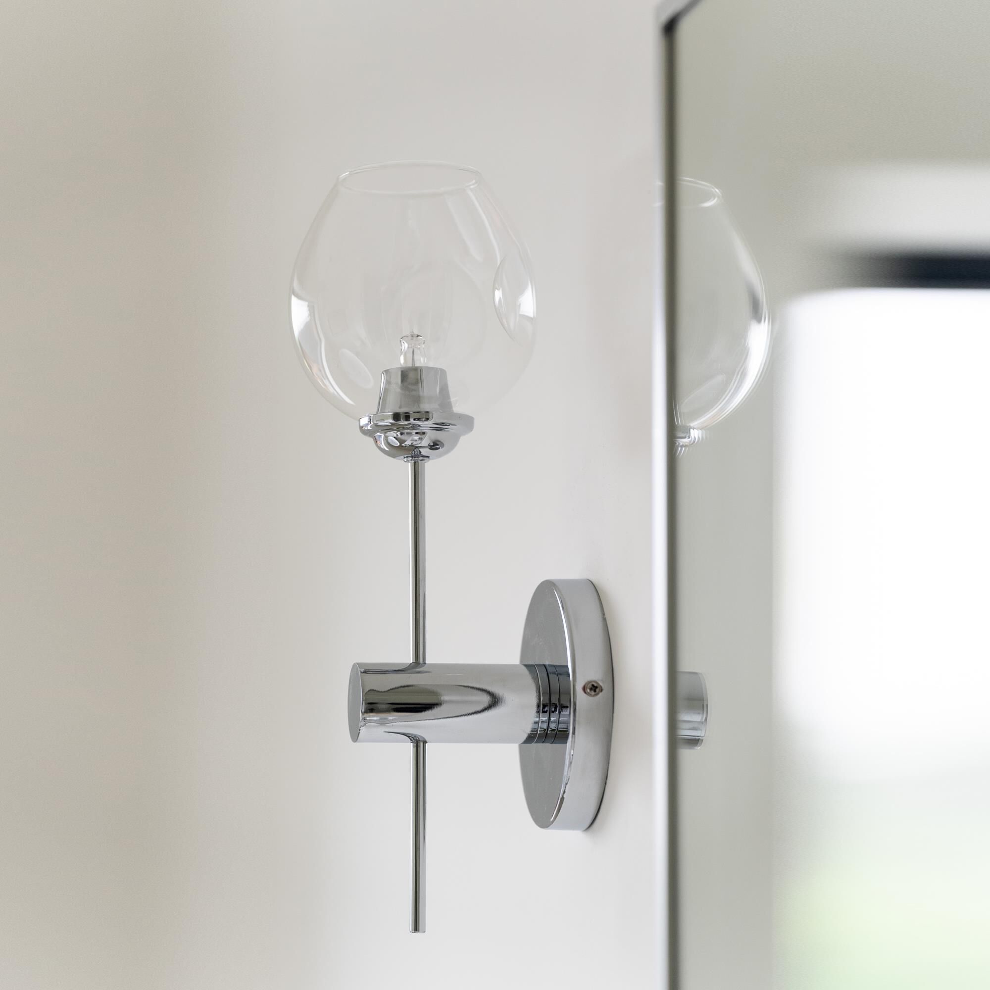 Shown in Polished Chrome finish and Clear accent