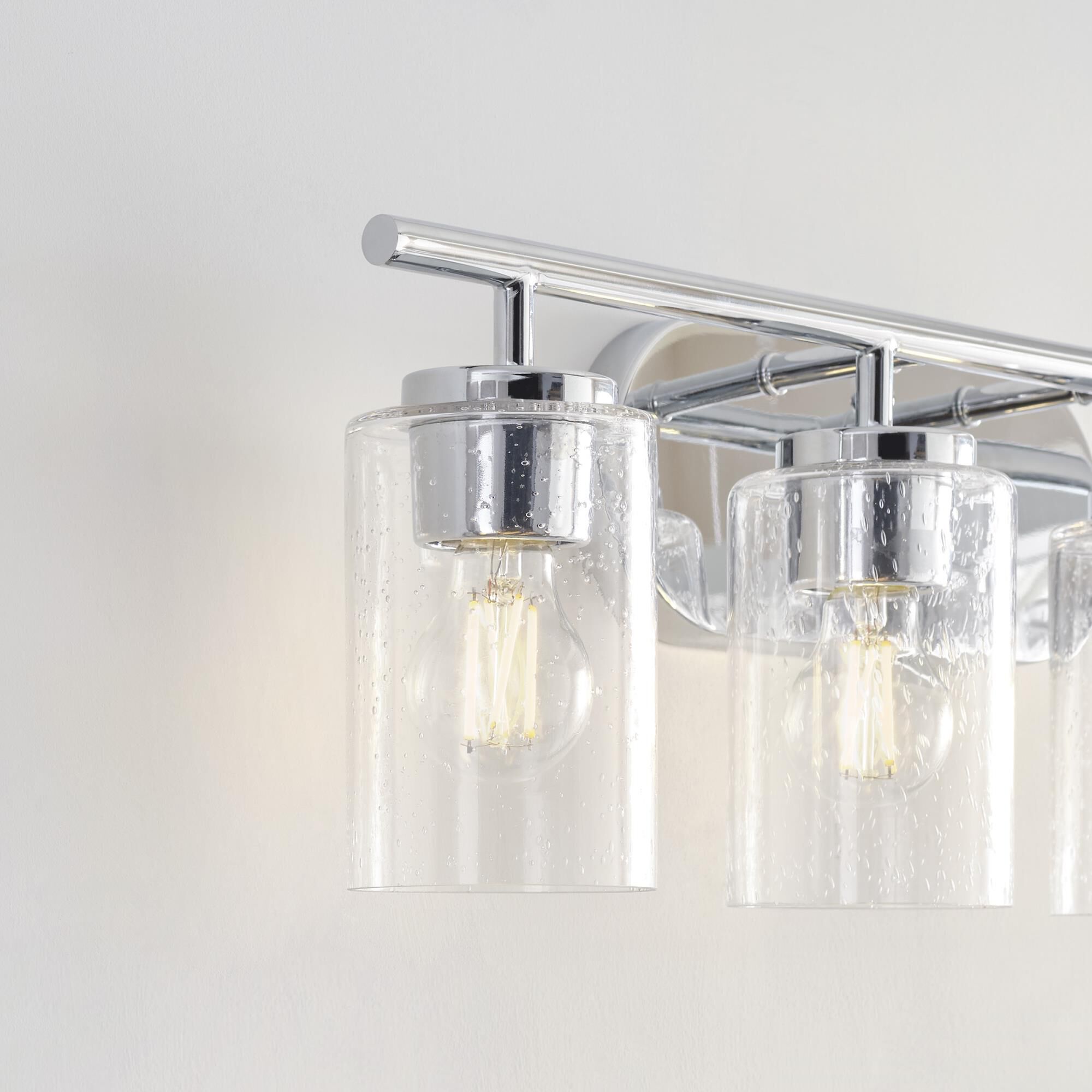 Shown in Chrome finish and Clear Seeded glass