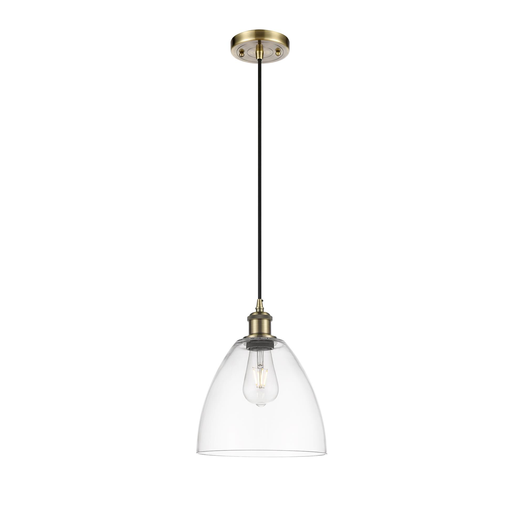 Shown in Antique Brass finish and Matte White glass