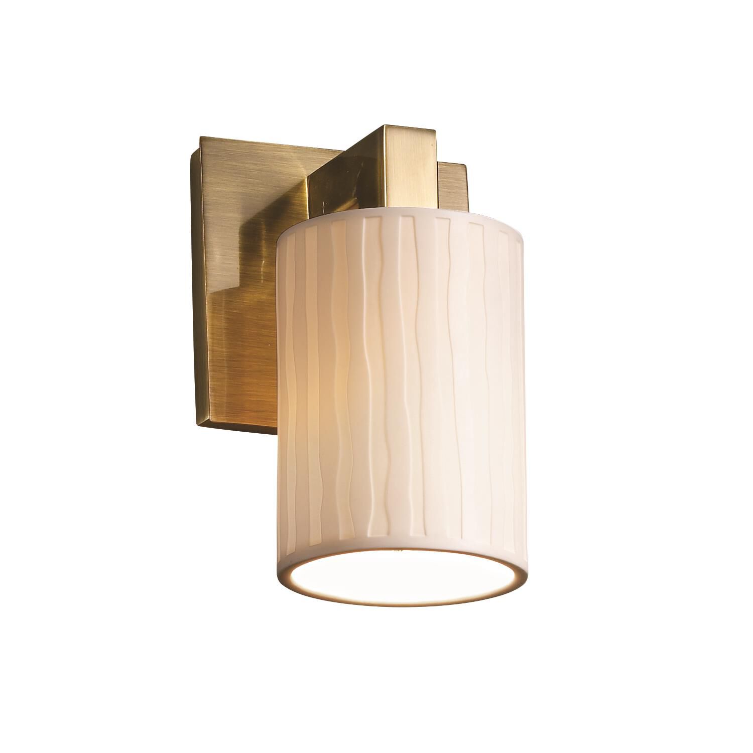 Shown in Antique Brass finish and Translucent Porcelain glass and Waterfall shade and Cylinder with Flat Rim accent