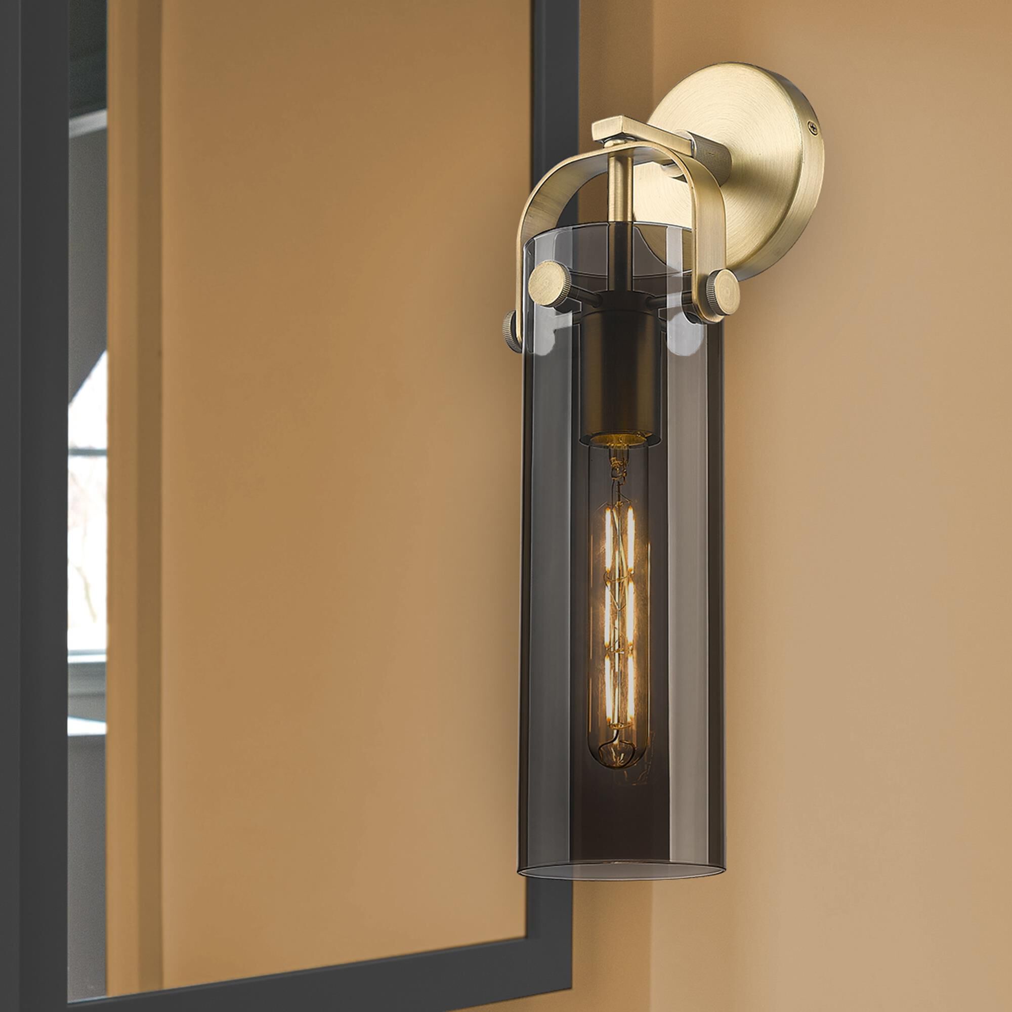 Shown in Brushed Brass finish and Plated Smoke glass