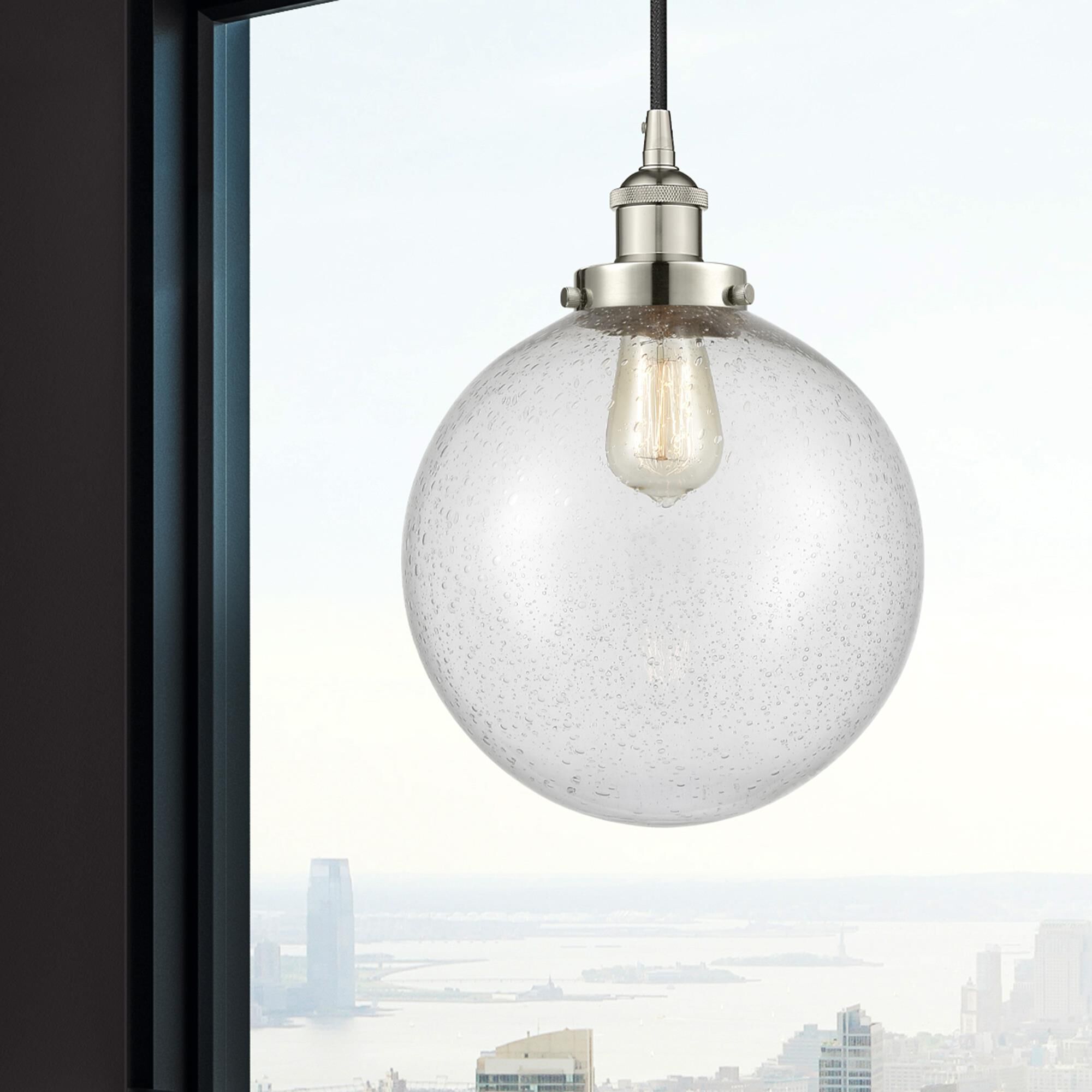 Shown in Polished Nickel finish and Seedy Beacon glass