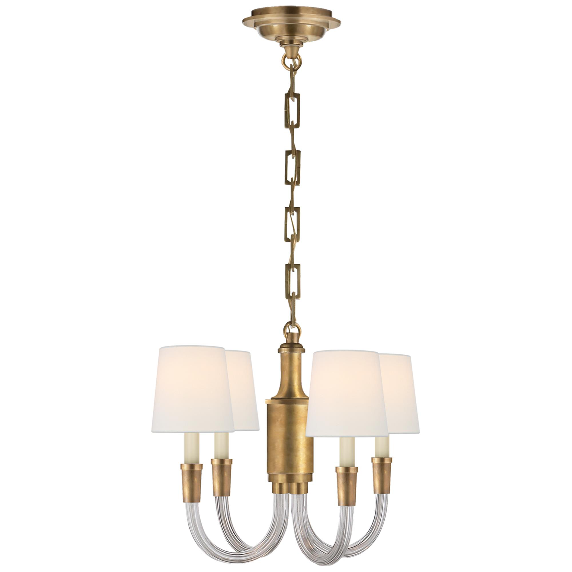 Shown in Crystal with Brass finish and Linen shade